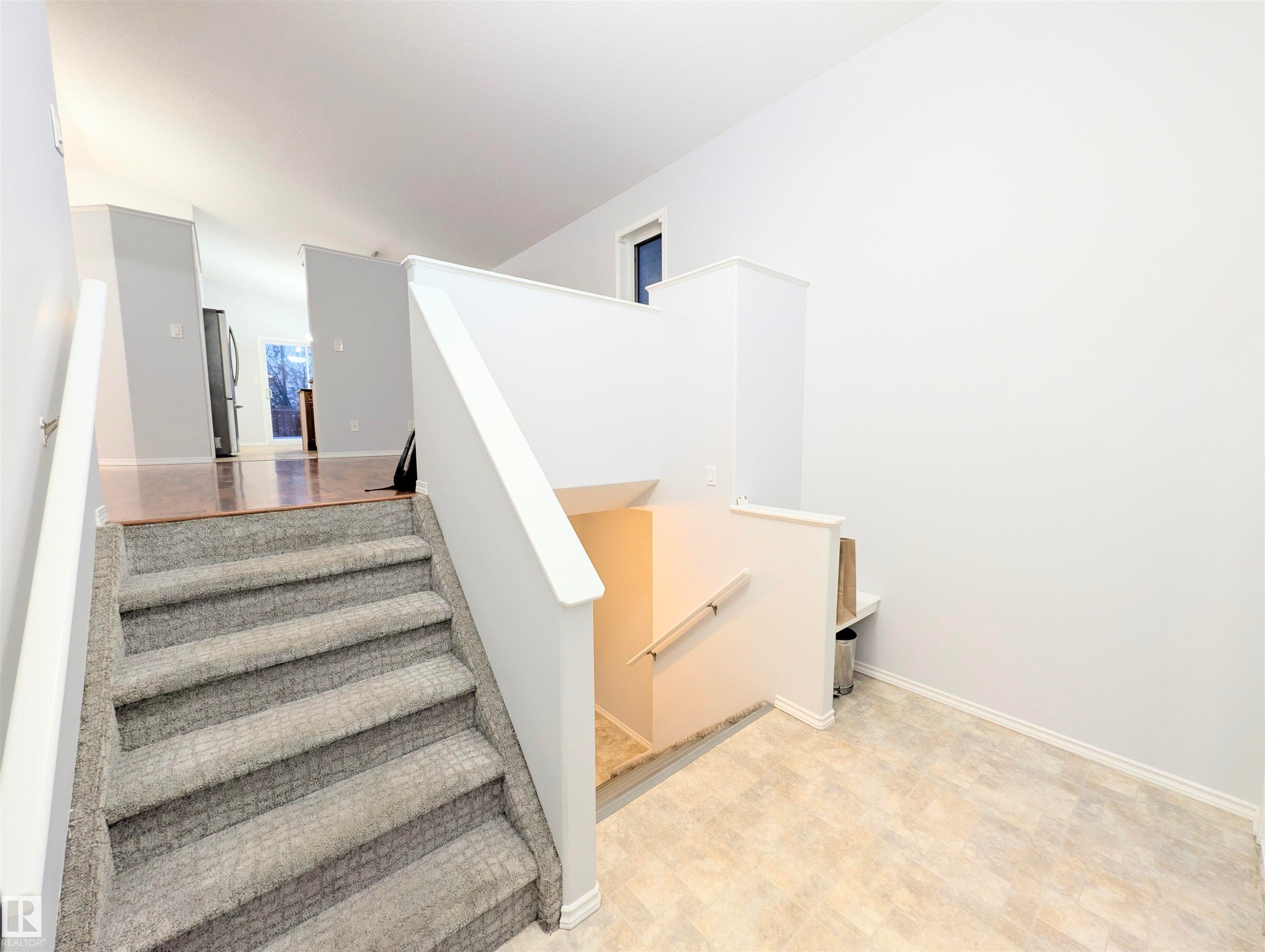 Stairs with baseboards - 3307 24 Avenue, Edmonton, AB - Indoor Photo Showing Other Room