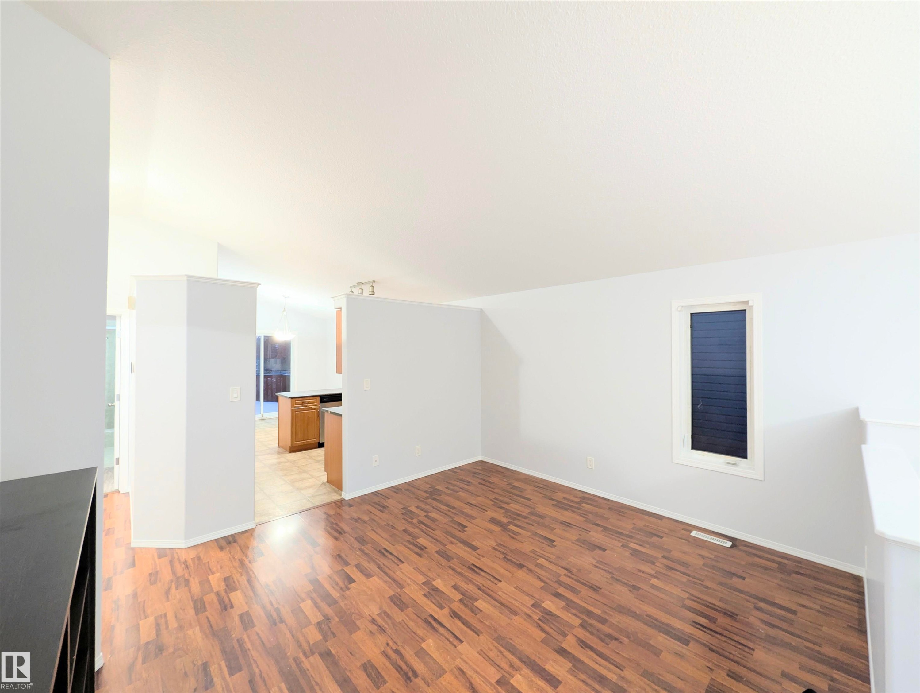 Bonus room with light wood-type flooring and baseboards - 3307 24 Avenue, Edmonton, AB - Indoor Photo Showing Other Room