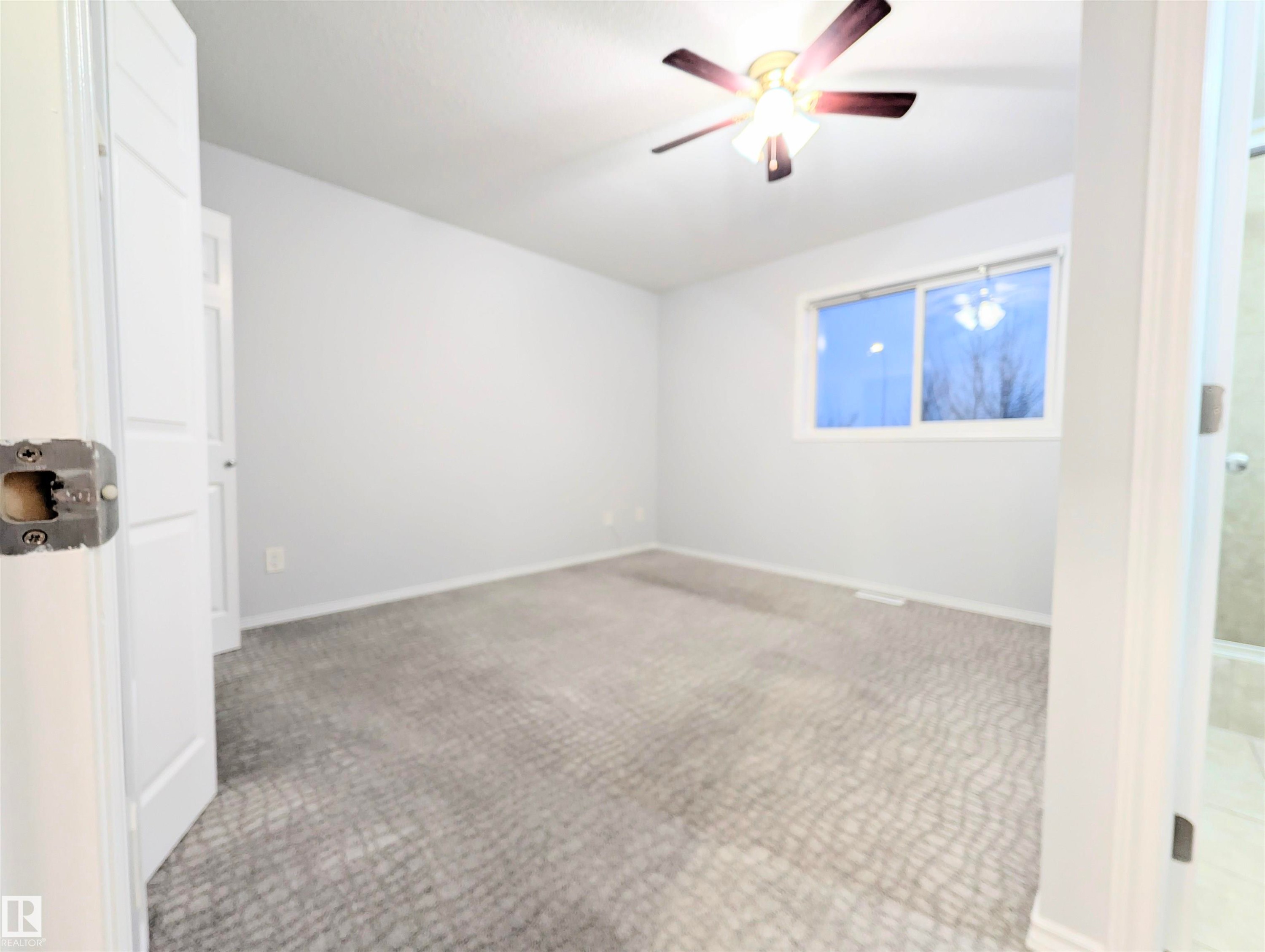 Spare room featuring carpet and ceiling fan - 3307 24 Avenue, Edmonton, AB - Indoor Photo Showing Other Room