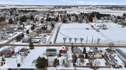 Snowy aerial view with a residential view -