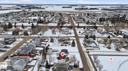Aerial overview of property's location with nearby suburban area -