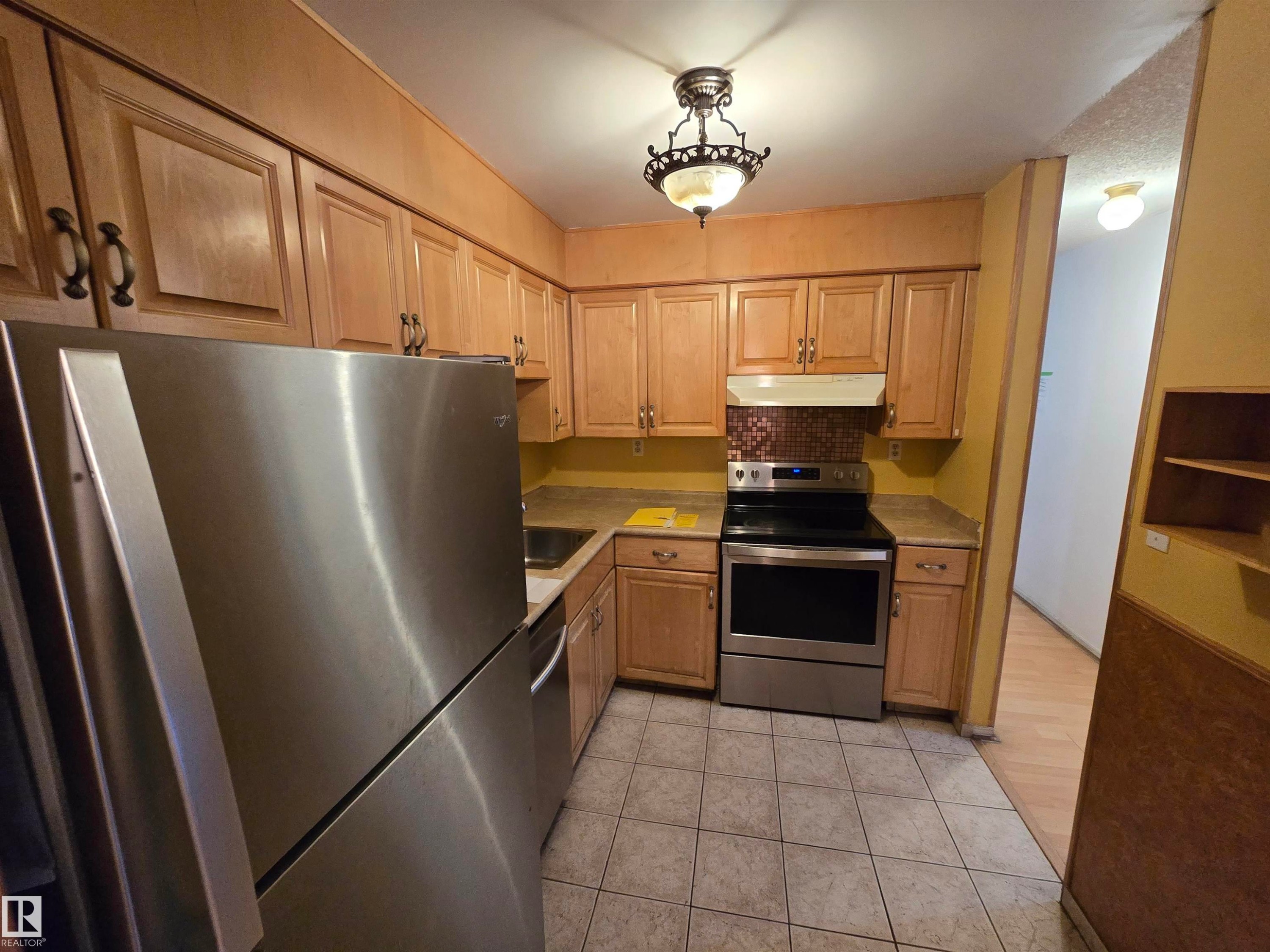 Edmonton, AB - Indoor Photo Showing Kitchen