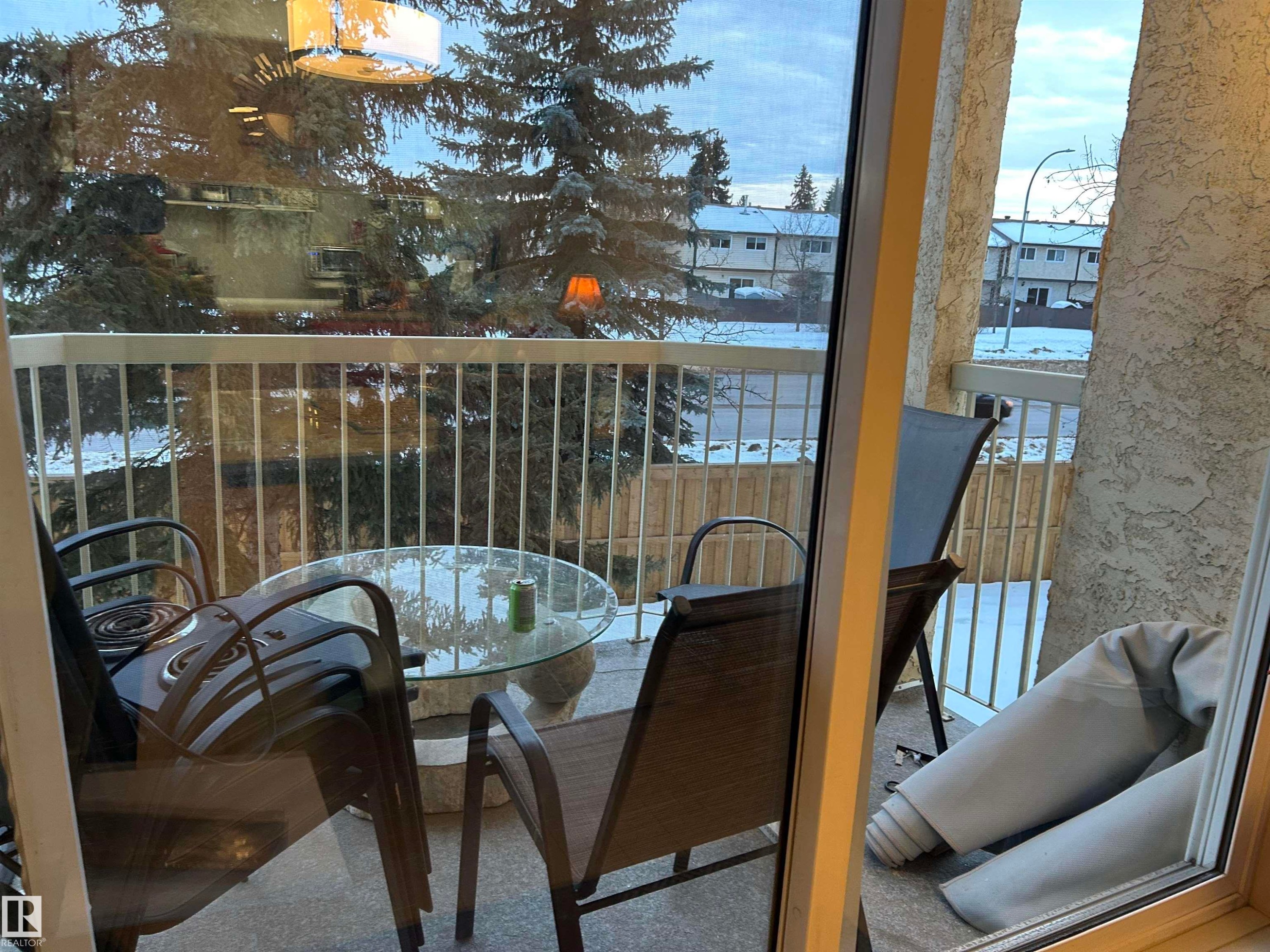 Snow covered back of property featuring outdoor dining space - 202 18020 95 Avenue, Edmonton, AB - Outdoor