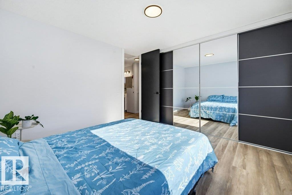 Bedroom featuring wood finished floors and a closet - 7016 92A Avenue, Edmonton, AB - Indoor Photo Showing Bedroom