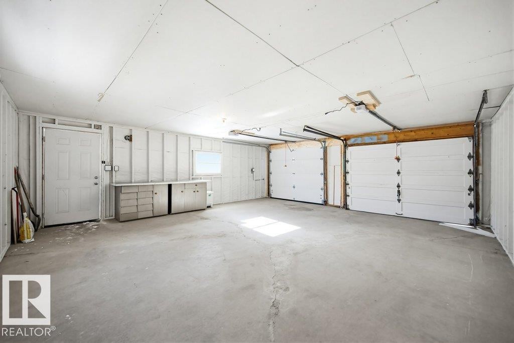View of garage - 7016 92A Avenue, Edmonton, AB - Indoor Photo Showing Garage