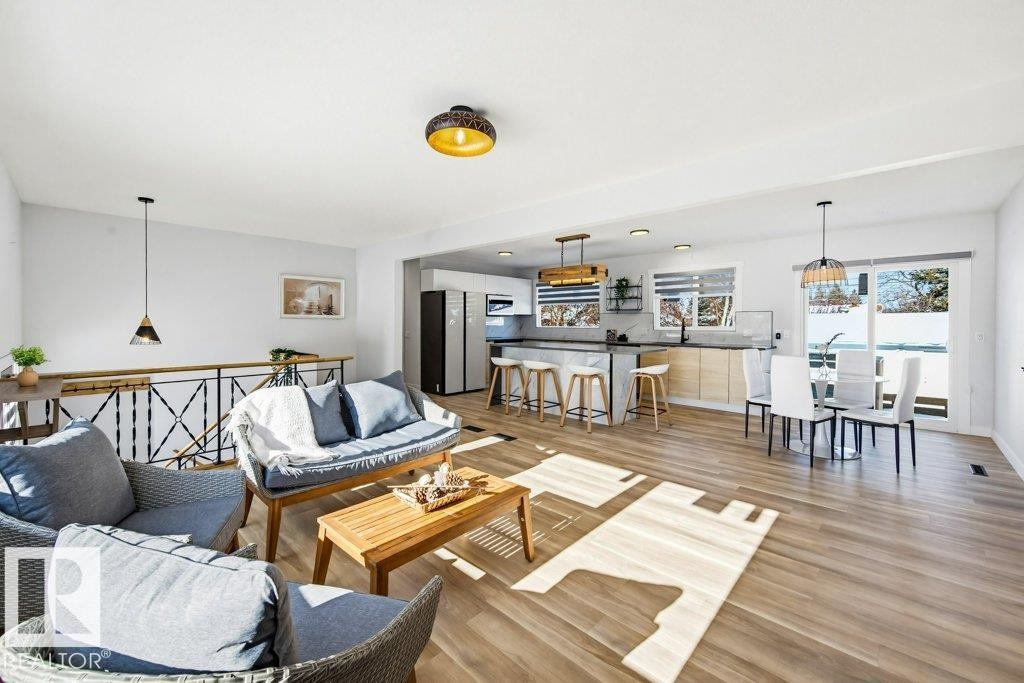 Living room with light wood finished floors - 7016 92A Avenue, Edmonton, AB - Indoor Photo Showing Living Room
