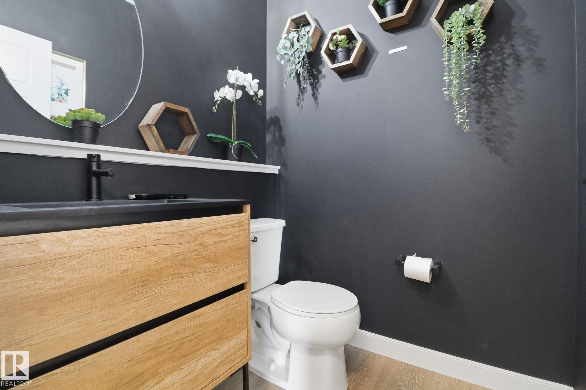 Bathroom with vanity and light wood-style flooring - 3234 Chernowski Way, Edmonton, AB - Indoor Photo Showing Bathroom