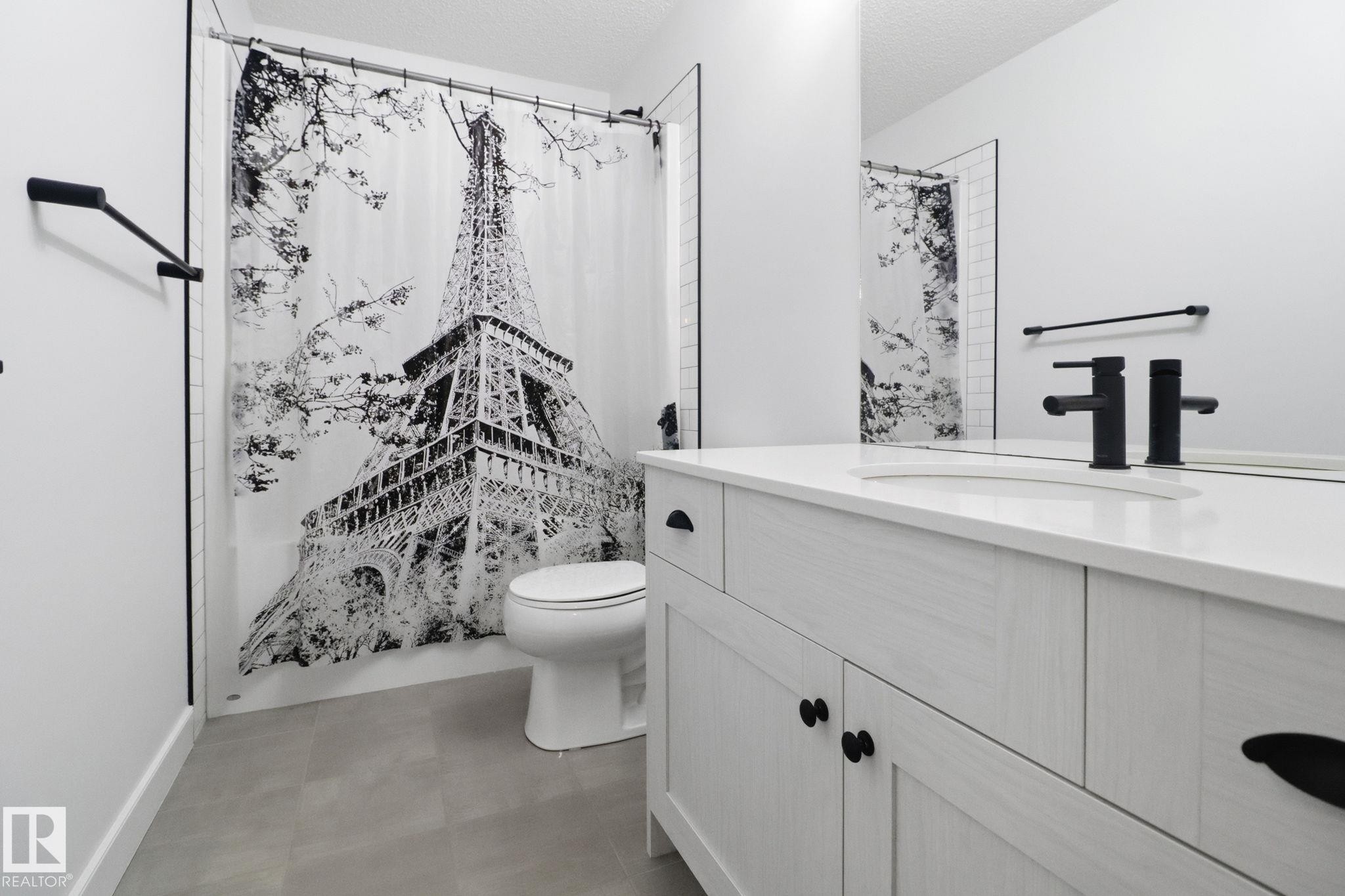 Full bathroom featuring vanity, shower / tub combo, and a textured ceiling - 3234 Chernowski Way, Edmonton, AB - Indoor Photo Showing Bathroom