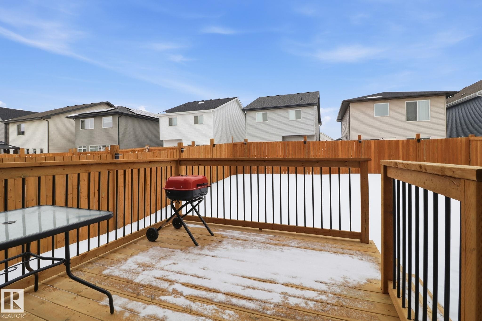 Wooden deck featuring a residential view and grilling area - 3234 Chernowski Way, Edmonton, AB - Outdoor With Exterior