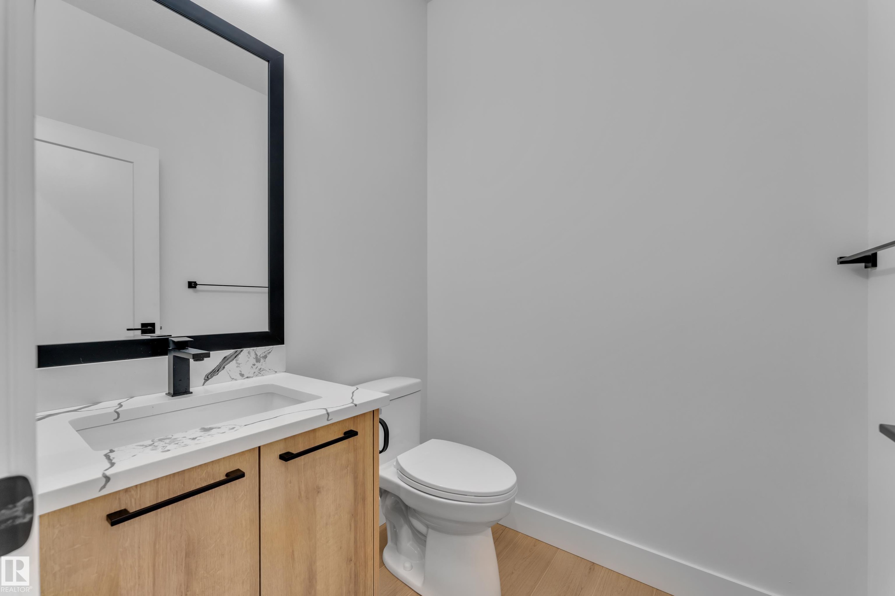 Bathroom featuring vanity and light wood finished floors - 741 Astoria Way, Devon, AB - Indoor Photo Showing Bathroom