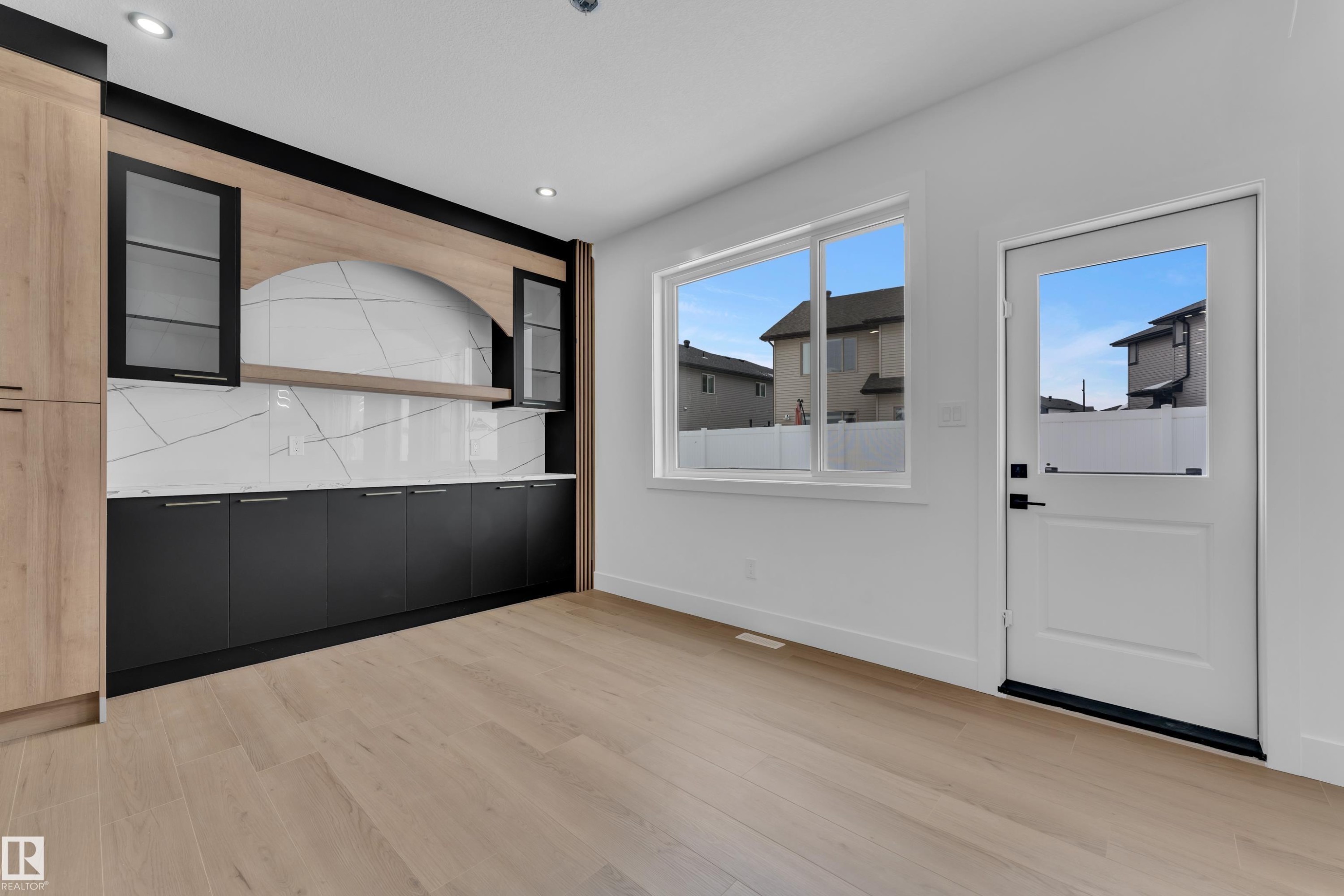 Unfurnished dining area with light wood-style flooring and recessed lighting - 741 Astoria Way, Devon, AB - Indoor Photo Showing Other Room