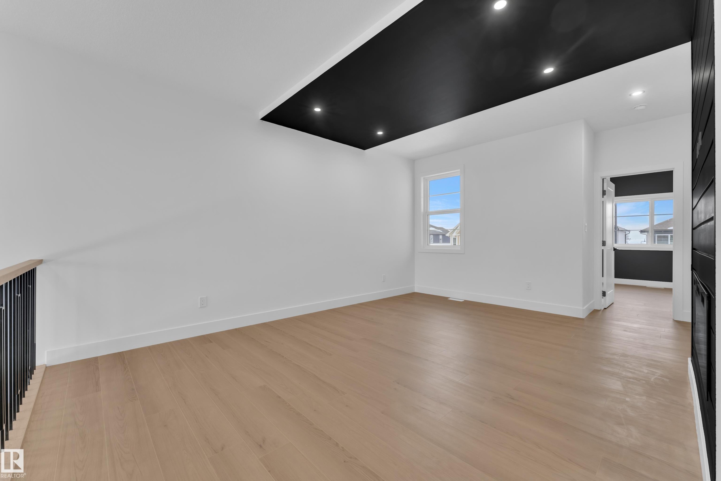 Unfurnished living room with light wood finished floors, plenty of natural light, and recessed lighting - 741 Astoria Way, Devon, AB - Indoor Photo Showing Other Room