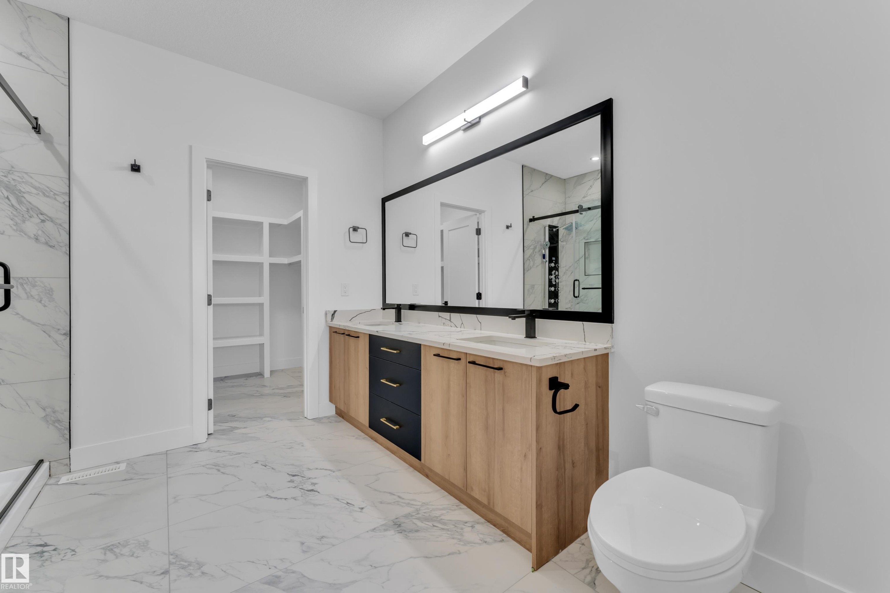 Bathroom with a marble finish shower, light marble finish flooring, and double vanity - 741 Astoria Way, Devon, AB - Indoor Photo Showing Bathroom