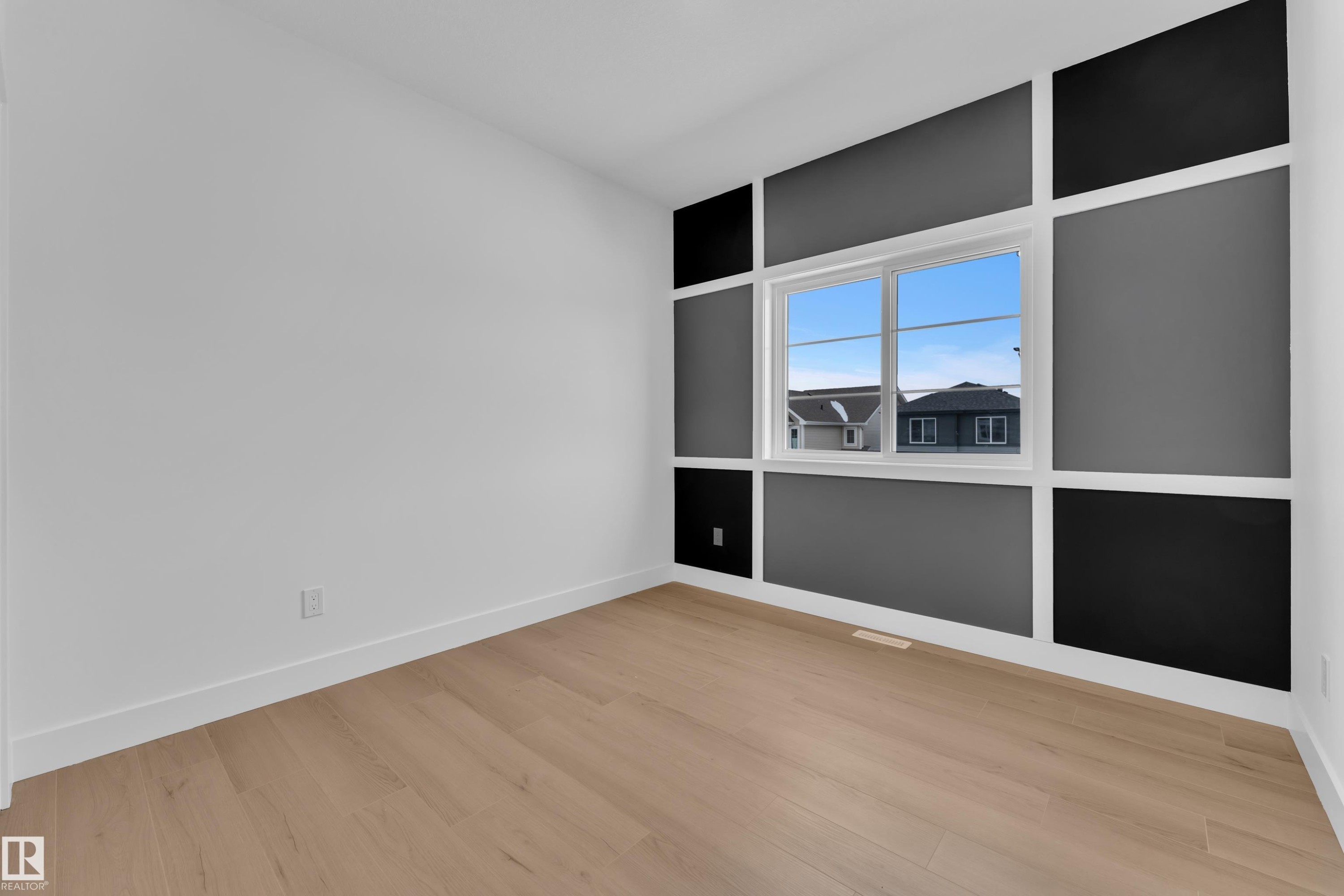 Unfurnished room with baseboards and light wood-style flooring - 741 Astoria Way, Devon, AB - Indoor Photo Showing Other Room