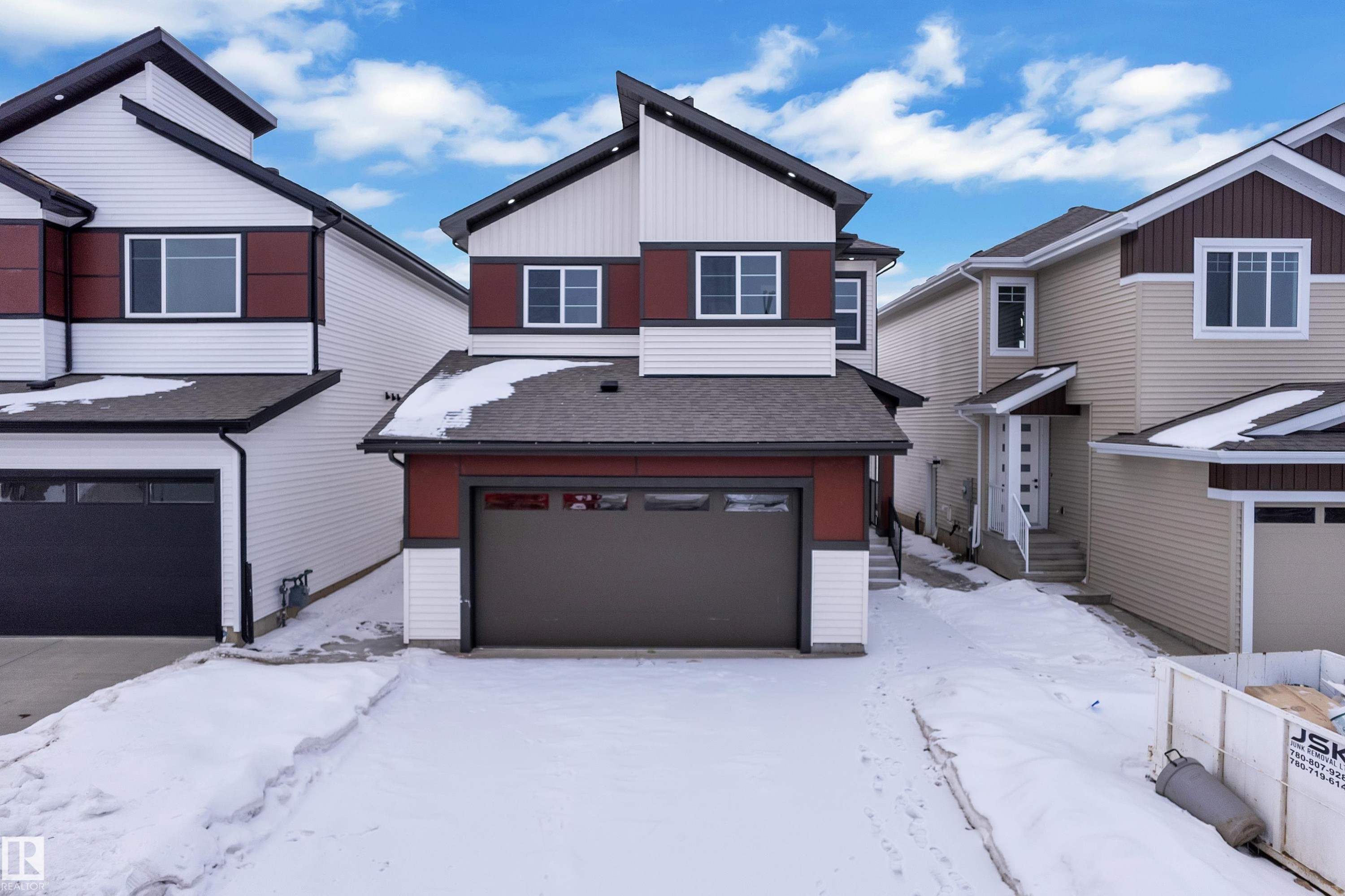 View of front of home with a shingled roof and an attached garage - 741 Astoria Way, Devon, AB - Outdoor