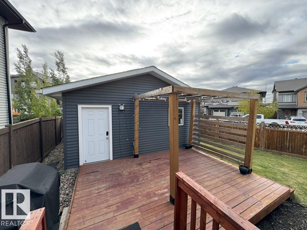 Wooden deck featuring a fenced backyard and a grill - 4303 Prowse Link, Edmonton, AB - Outdoor