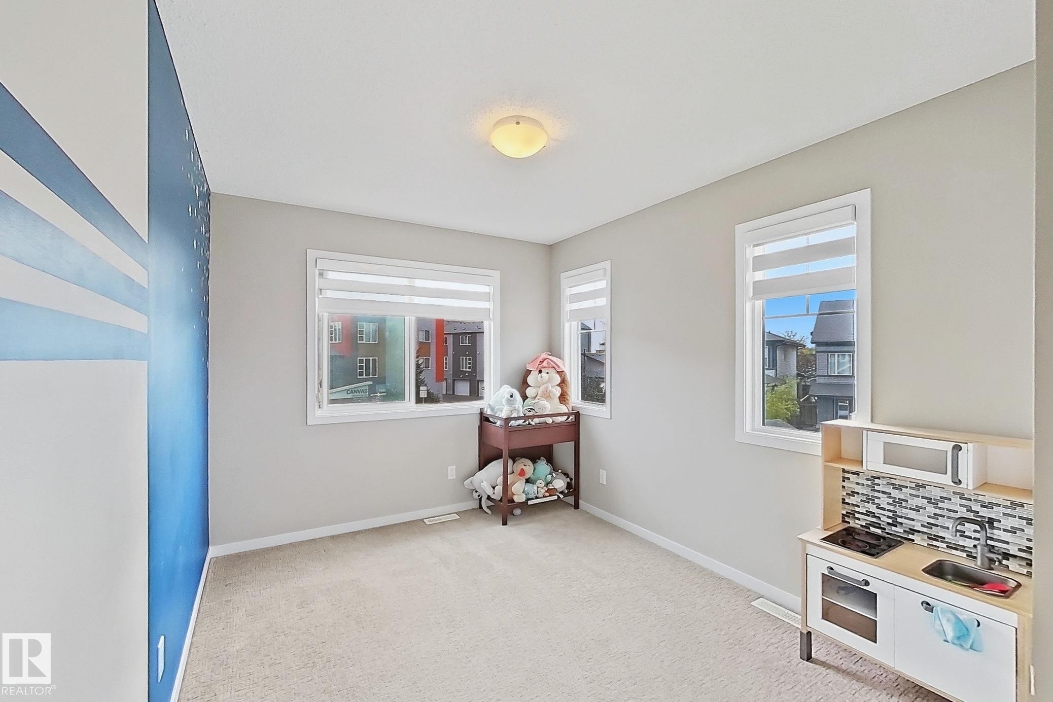 Game room with baseboards and light colored carpet - 4303 Prowse Link, Edmonton, AB - Indoor