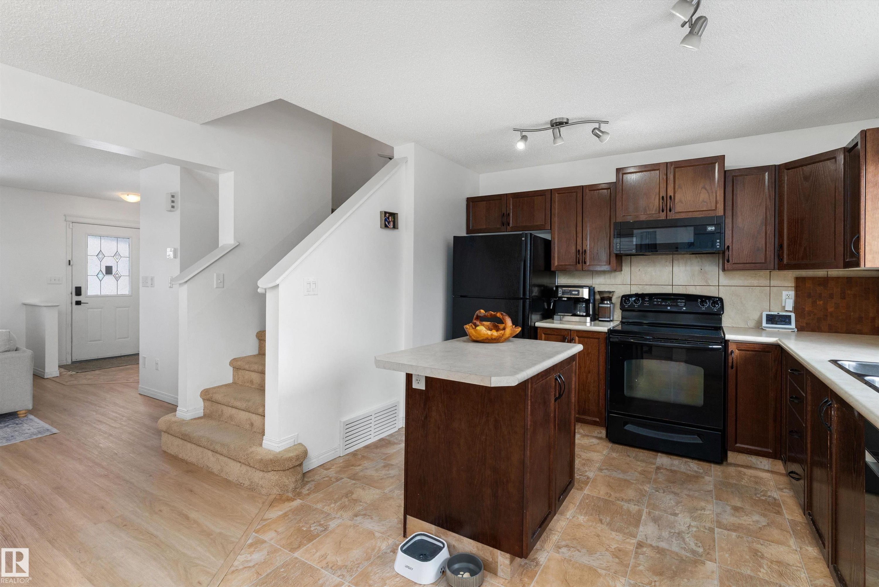 419 Songhurst Place, Leduc, AB - Indoor Photo Showing Kitchen With Double Sink