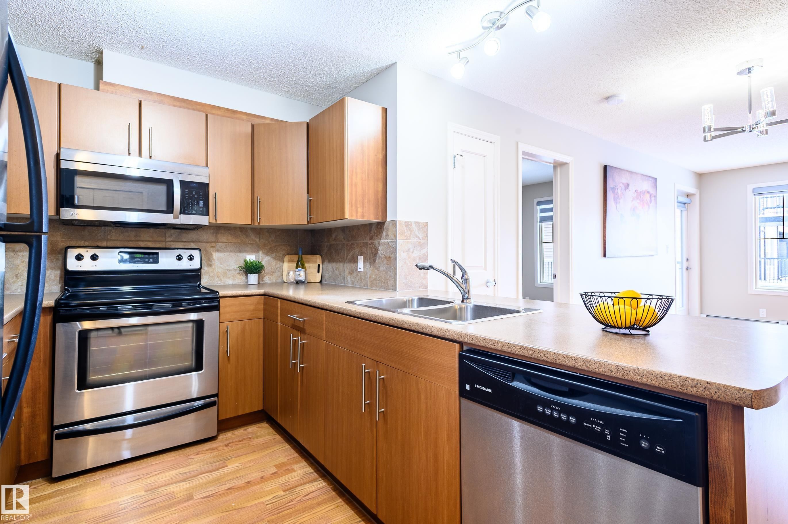 213 105 Ambleside Drive, Edmonton, AB - Indoor Photo Showing Kitchen With Stainless Steel Kitchen With Double Sink