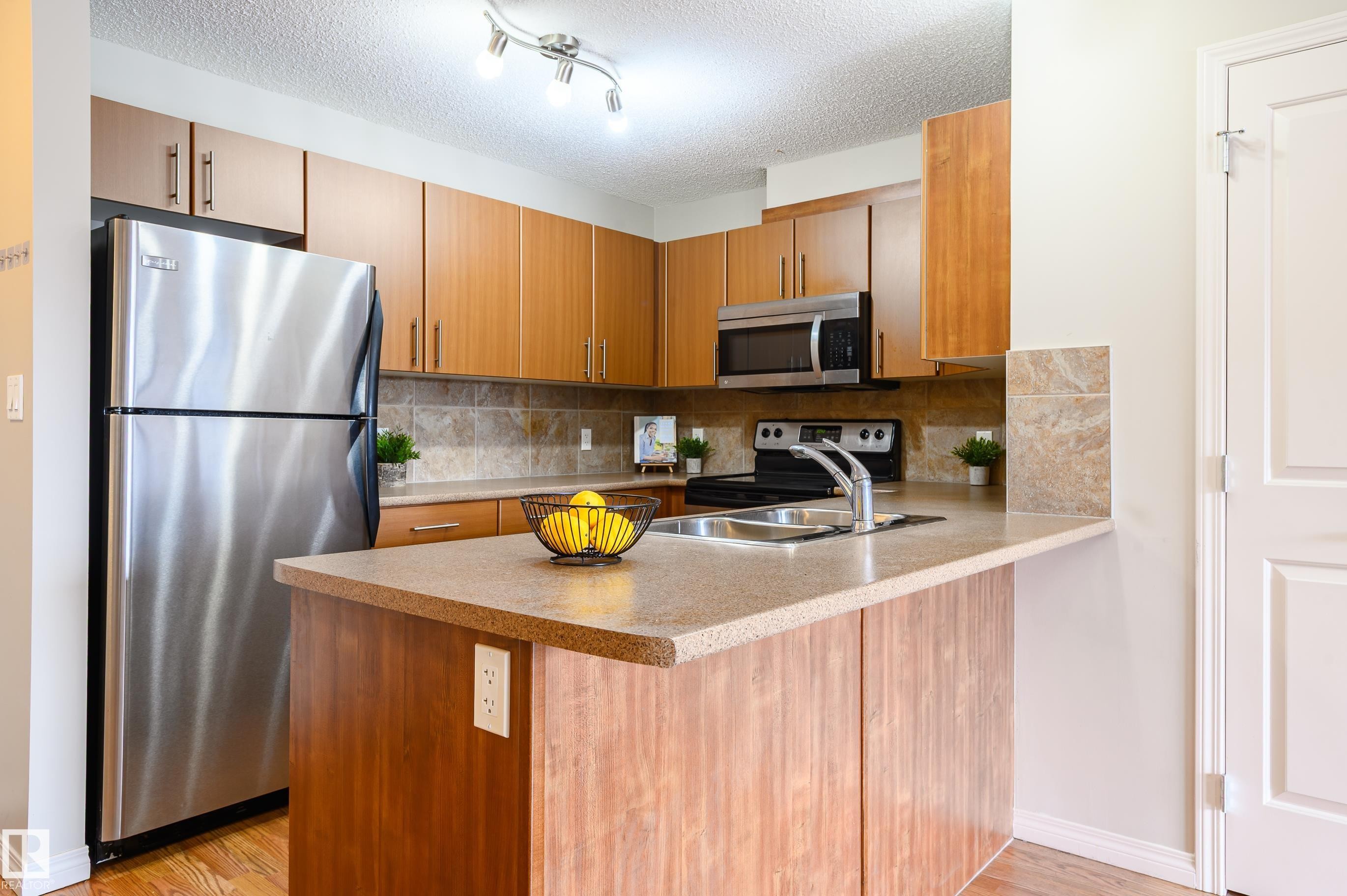 213 105 Ambleside Drive, Edmonton, AB - Indoor Photo Showing Kitchen With Stainless Steel Kitchen With Double Sink