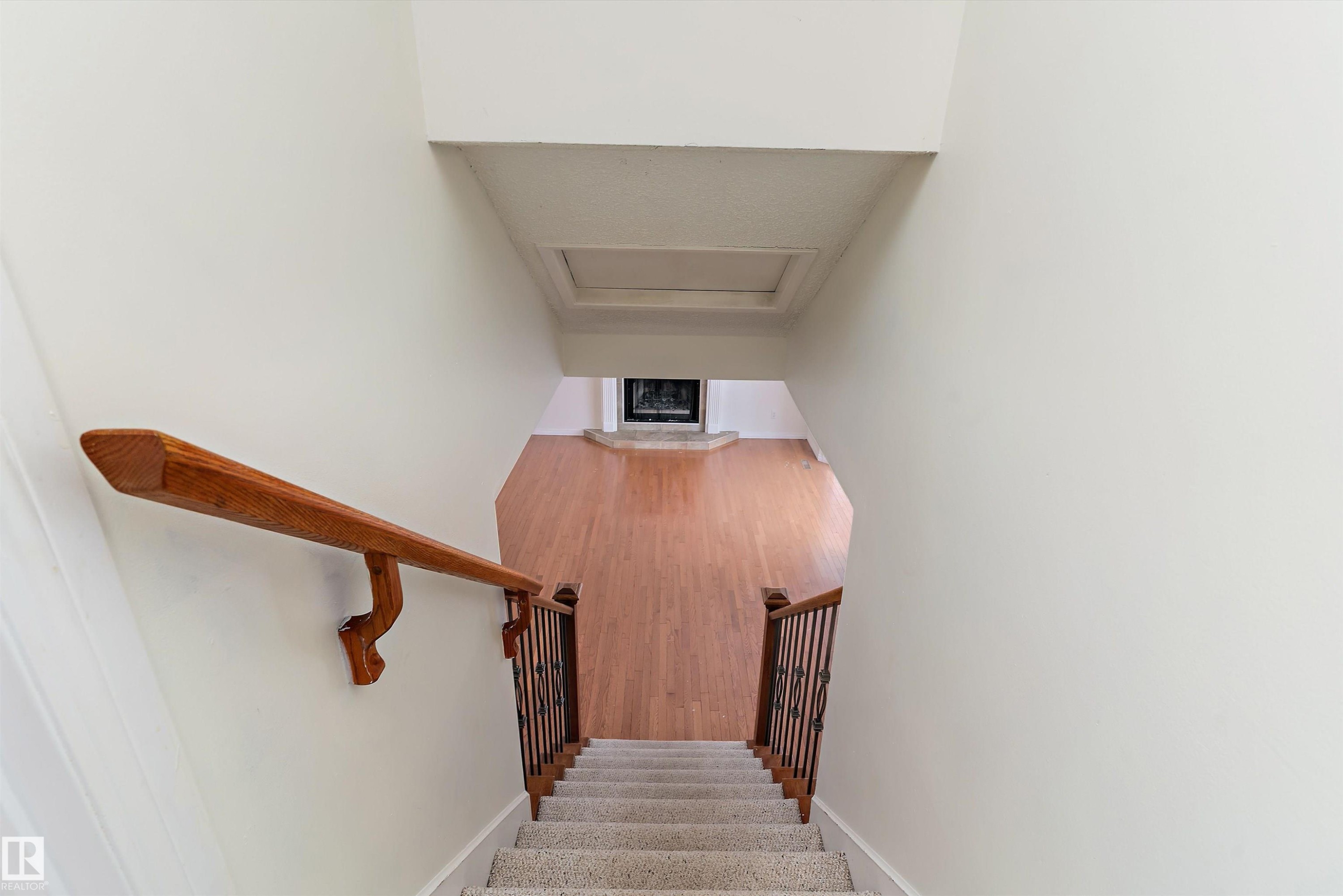 Stairs with attic access and wood finished floors - 115 Walker Road, Edmonton, AB - Indoor