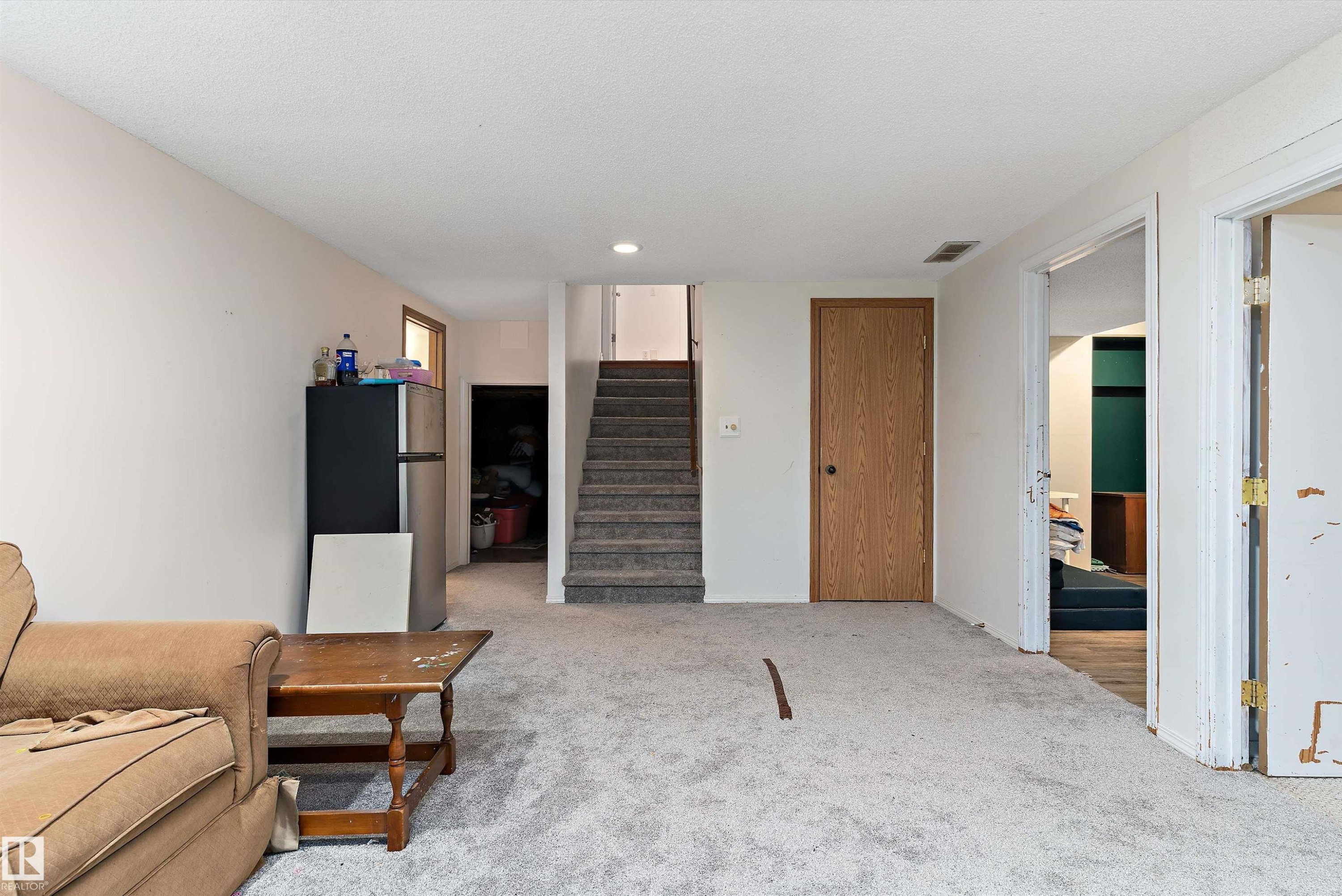 Living area with light colored carpet and recessed lighting - 115 Walker Road, Edmonton, AB - Indoor