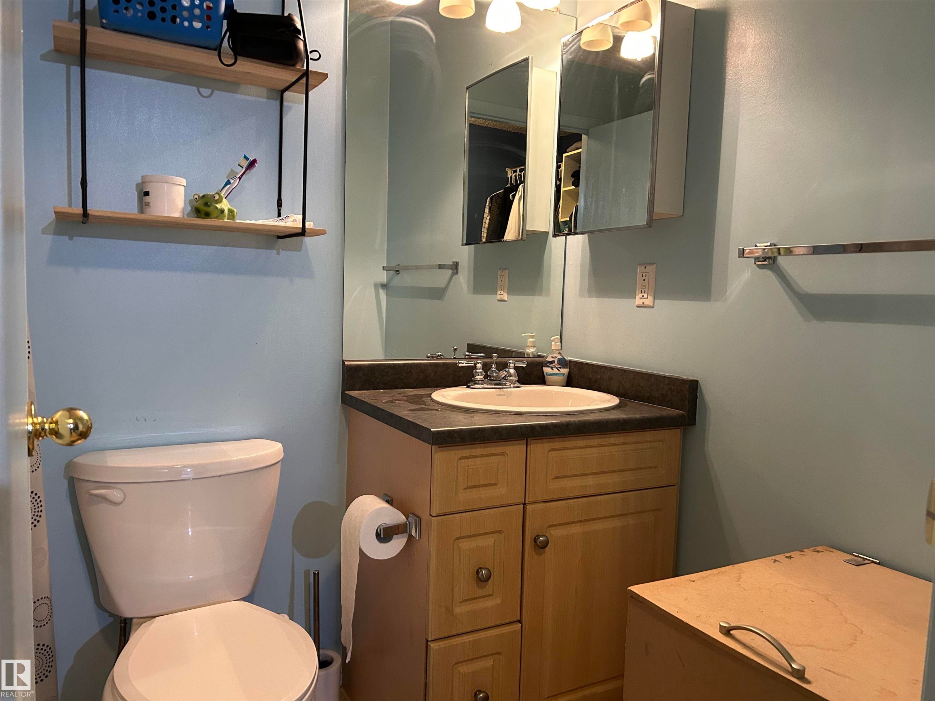 Bathroom with vanity and toilet - 310 2430 Guardian Road, Edmonton, AB - Indoor Photo Showing Bathroom