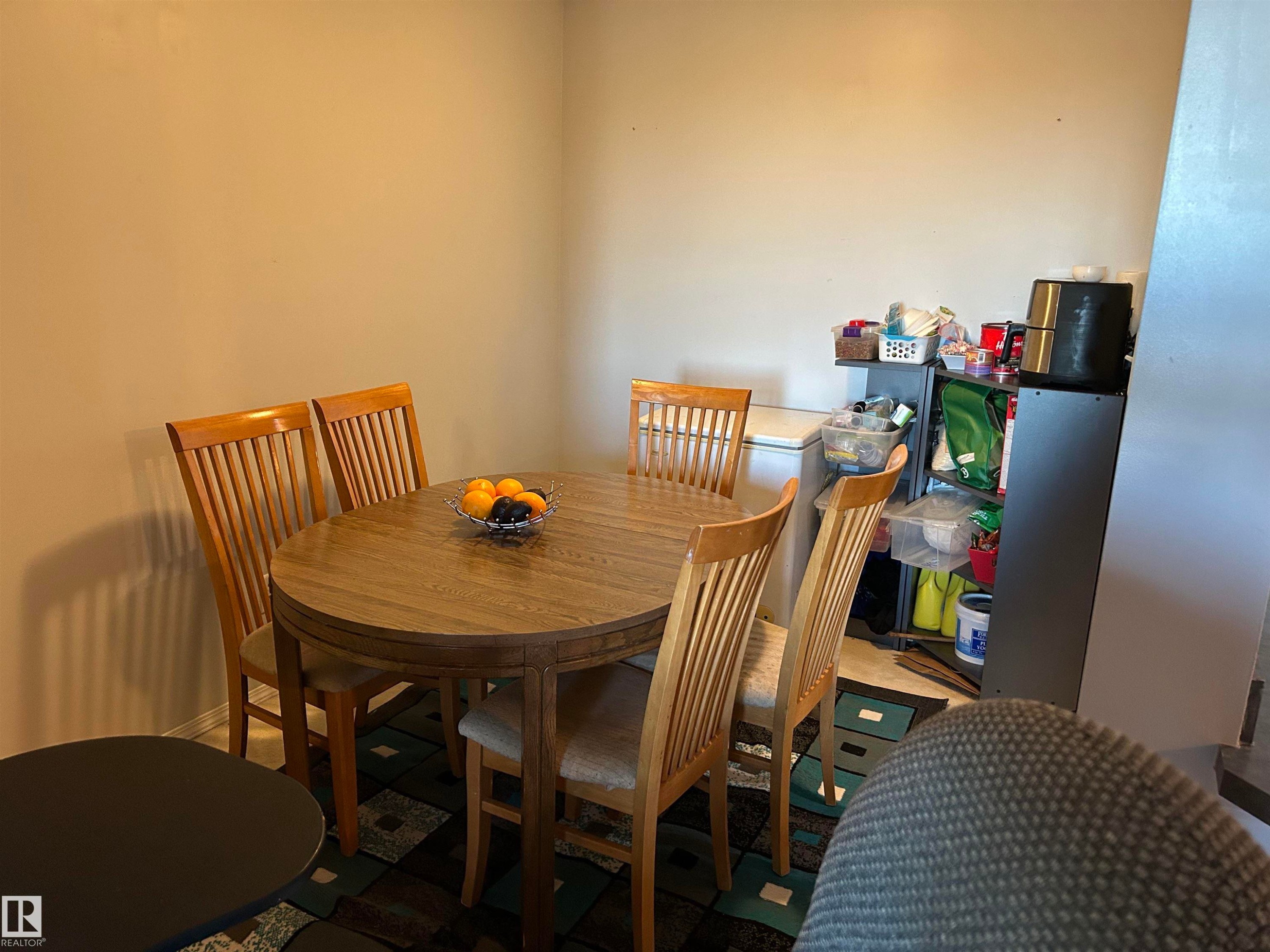 Dining space featuring baseboards - 310 2430 Guardian Road, Edmonton, AB - Indoor Photo Showing Dining Room