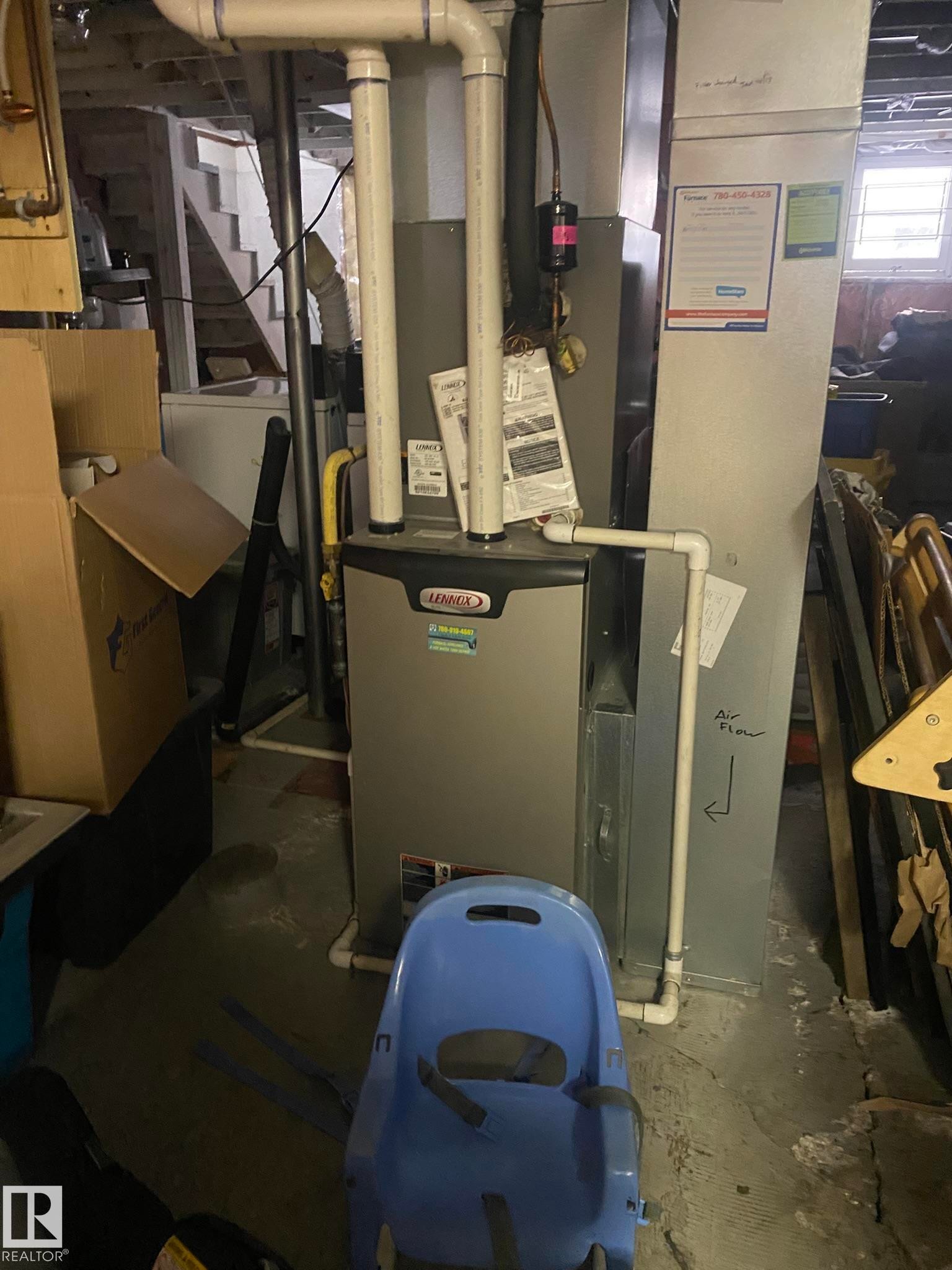 Utility room with heating unit and washer / clothes dryer - 10945 54 Avenue, Edmonton, AB - Indoor Photo Showing Basement
