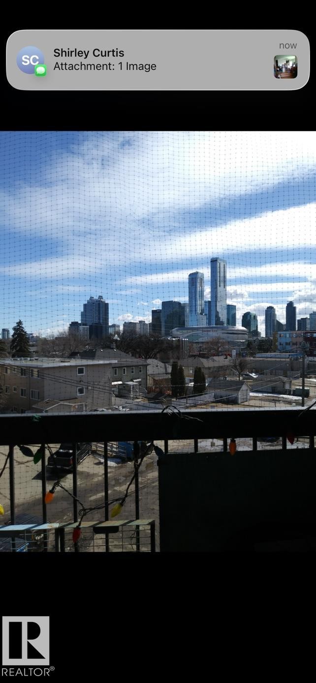 Enjoy expansive views of the city skyline and surrounding neighborhood from the property's vantage point - 401 10743 107 Street Nw, Edmonton, AB - Outdoor With View