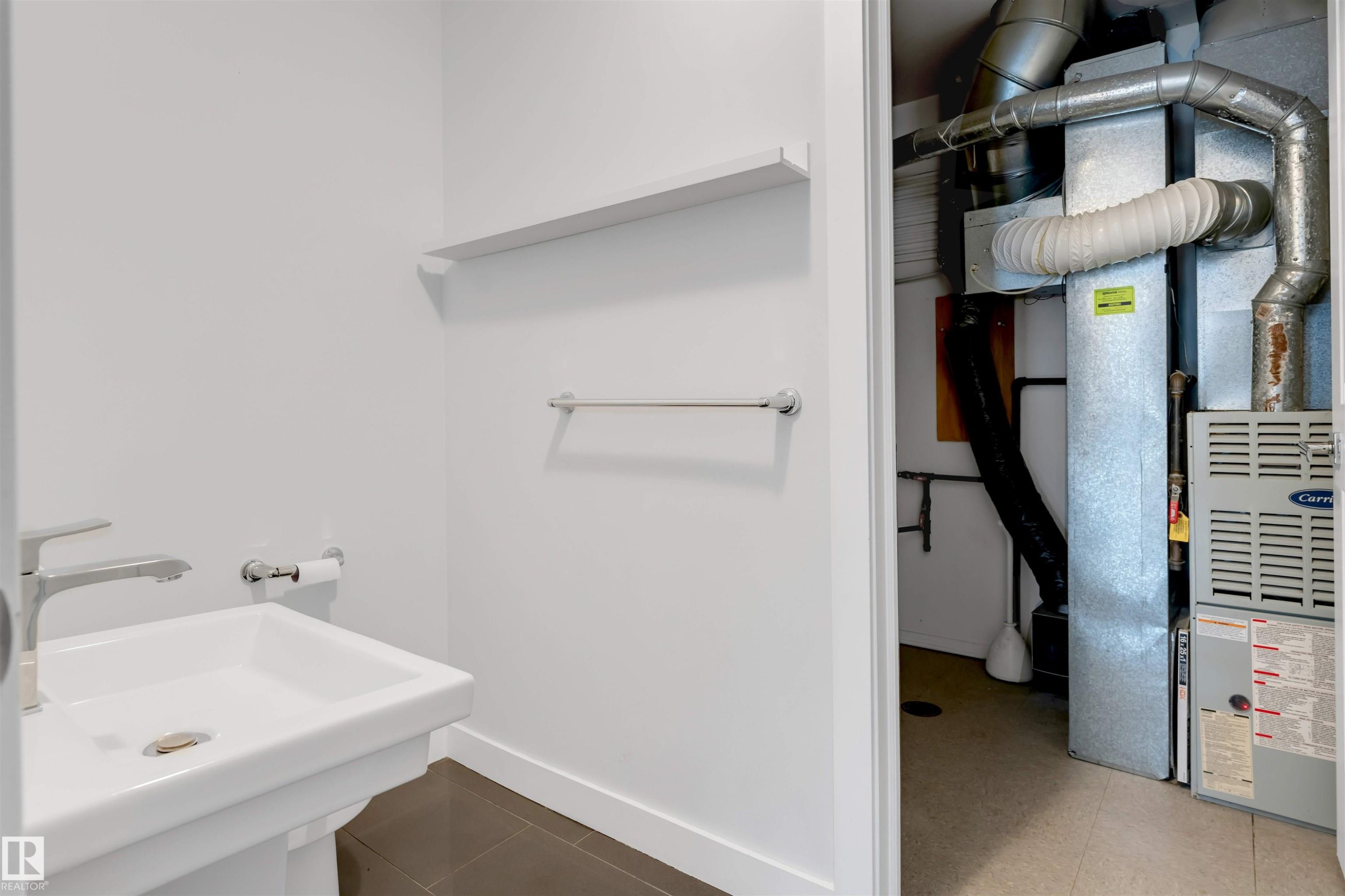 Bathroom with heating unit - 102 10711 83 Avenue, Edmonton, AB - Indoor Photo Showing Bathroom