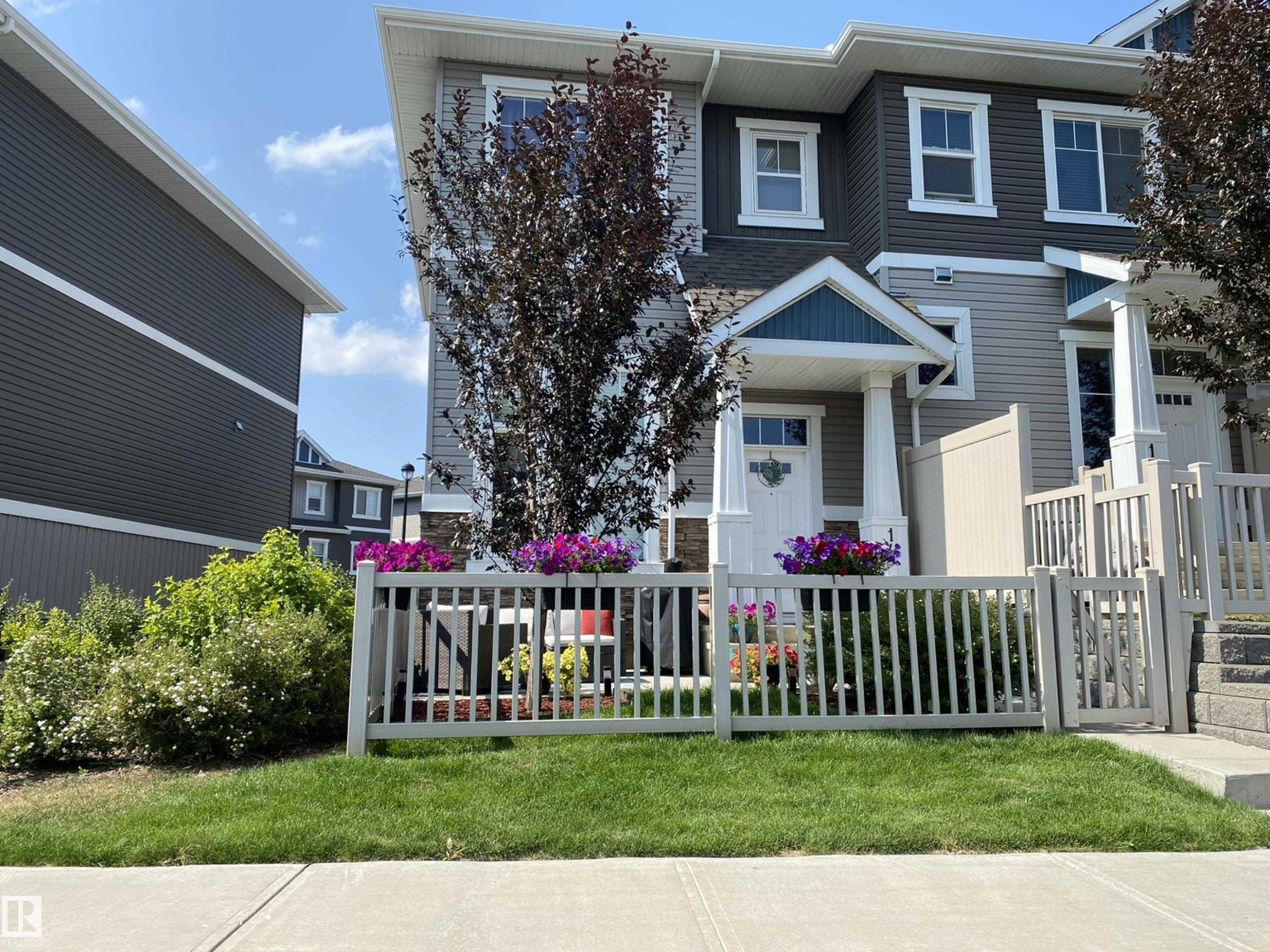 View of front of home with a fenced front yard - 14 1140 Chappelle Boulevard, Edmonton, AB - Outdoor