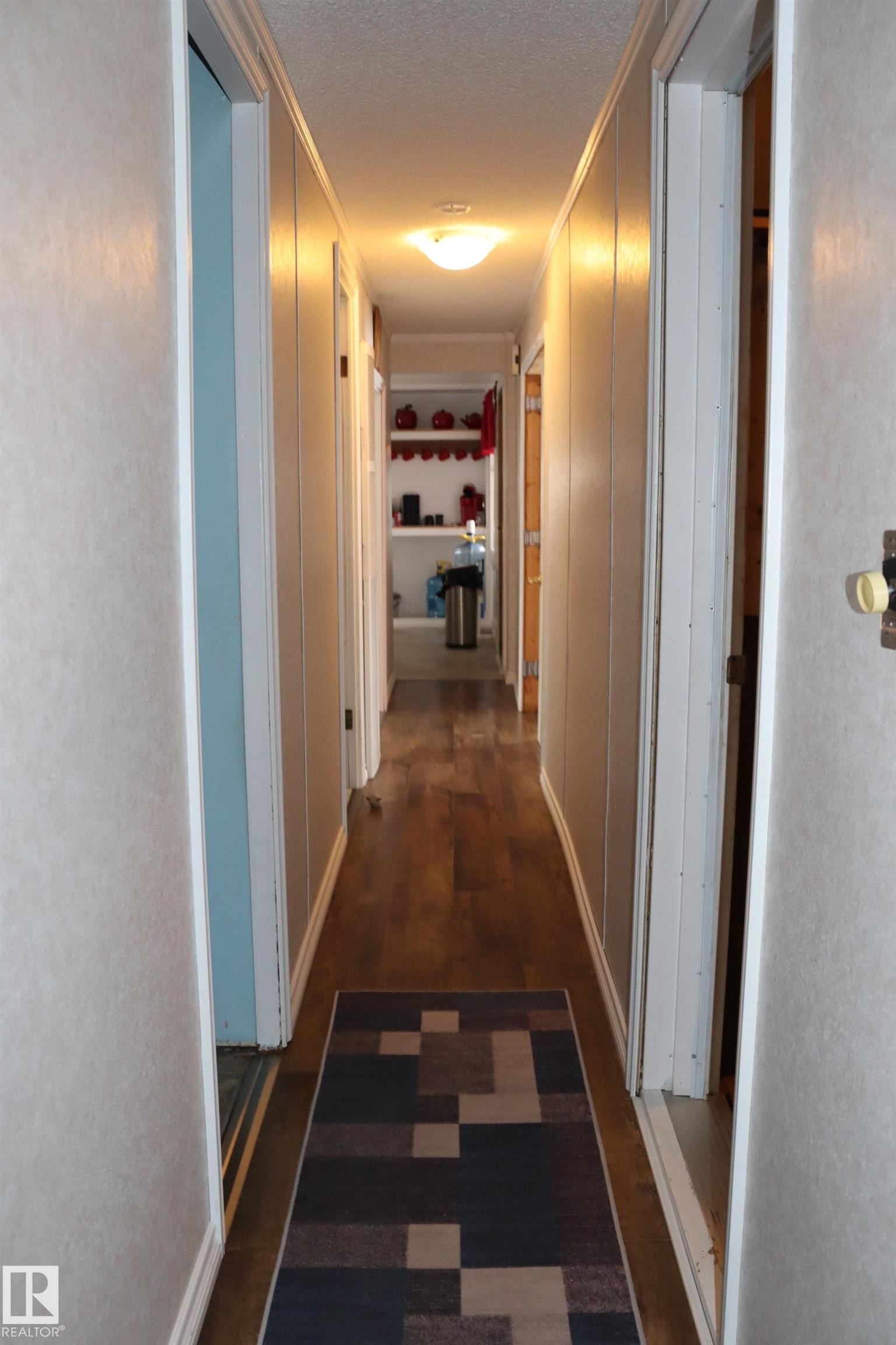 leading from the back of the mobile to the front. - 56 4204 47St., Wetaskiwin, AB - Indoor Photo Showing Other Room