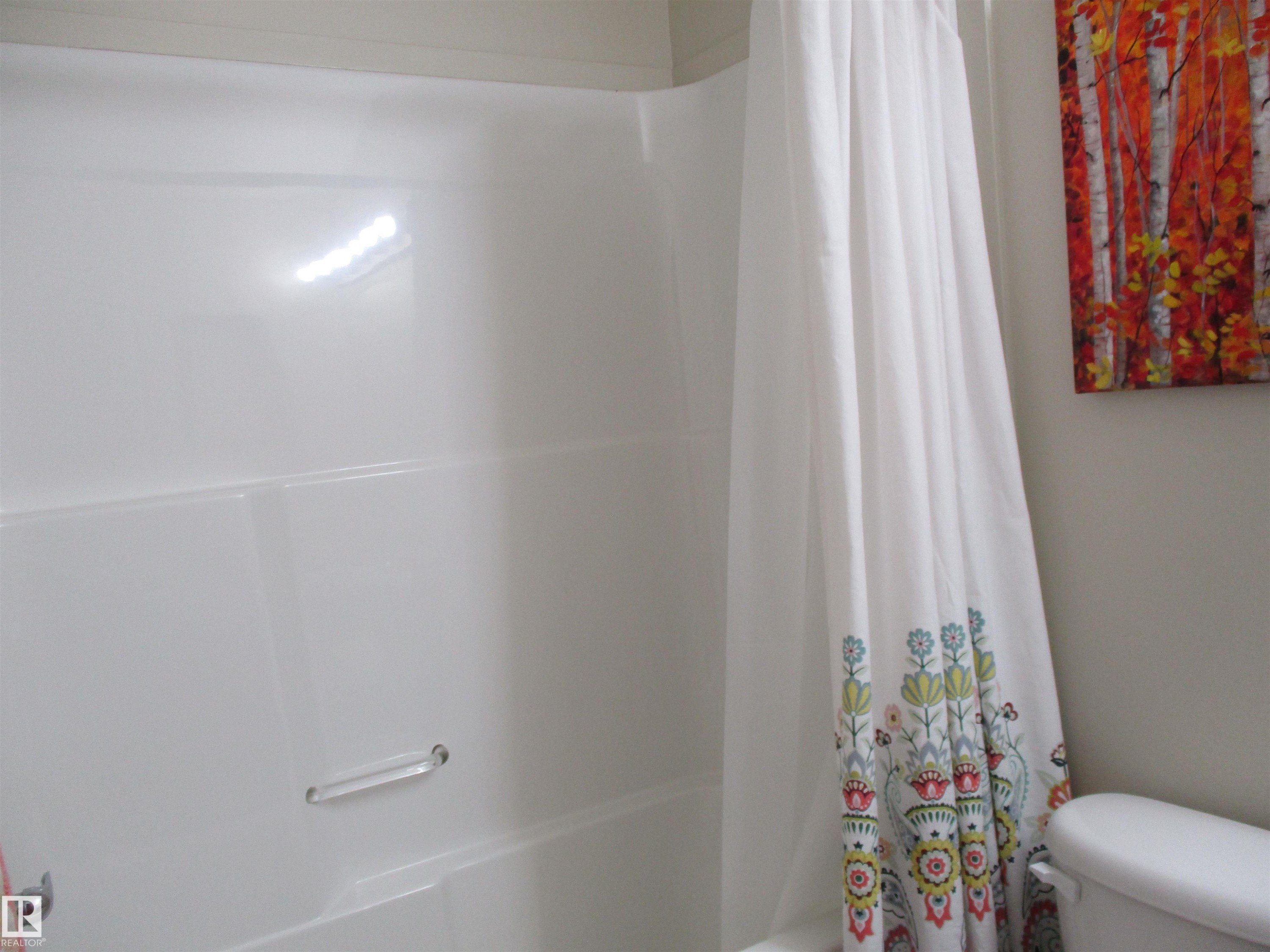 Full bath with shower / bathtub combination with curtain and toilet - 3309 9351 Simpson Drive, Edmonton, AB - Indoor Photo Showing Bathroom