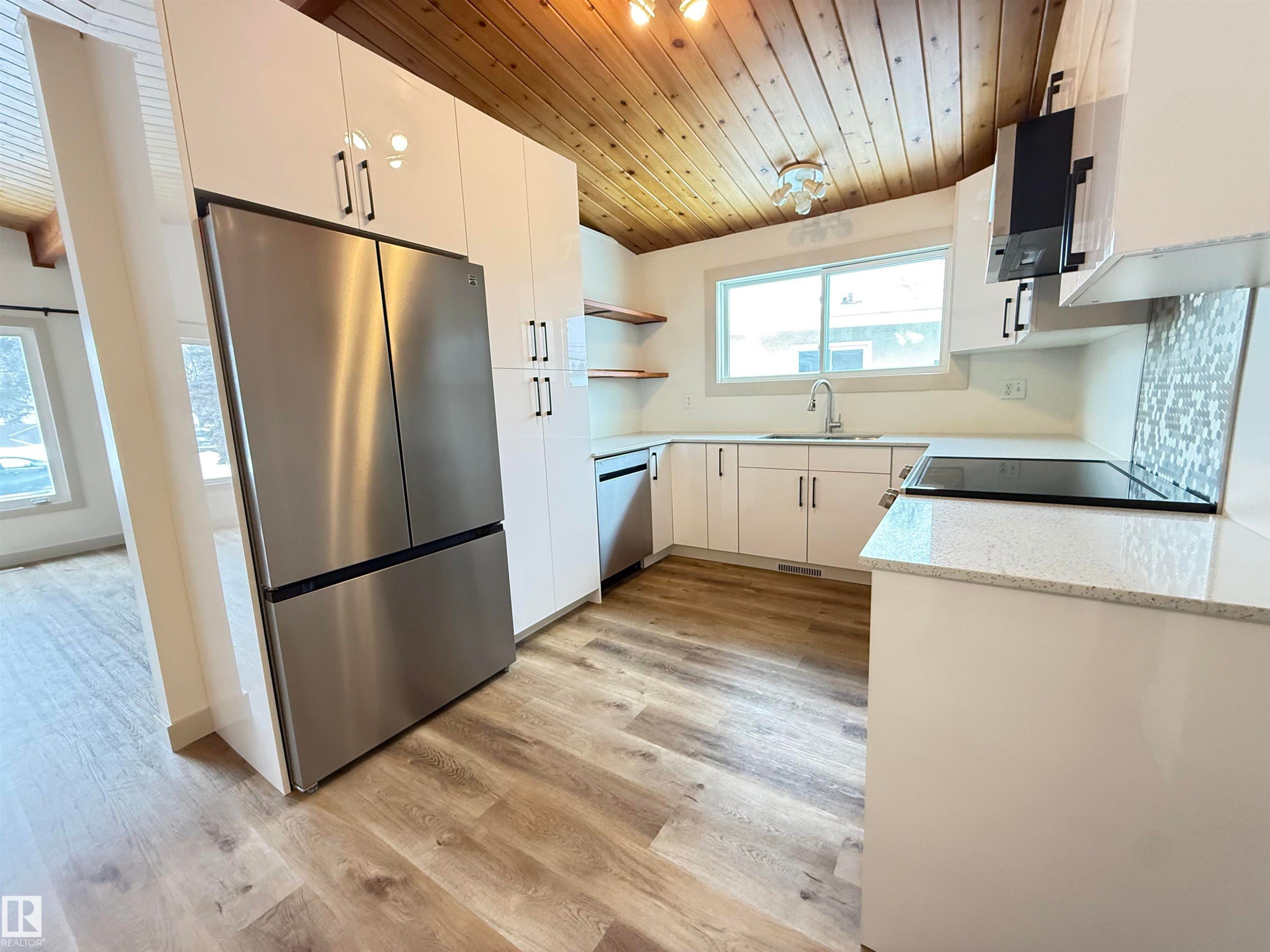 Kitchen featuring wood ceiling, open shelves, stainless steel appliances, white cabinets, and light wood-style floors - 9034 60 Street, Edmonton, AB - Indoor Photo Showing Kitchen With Stainless Steel Kitchen