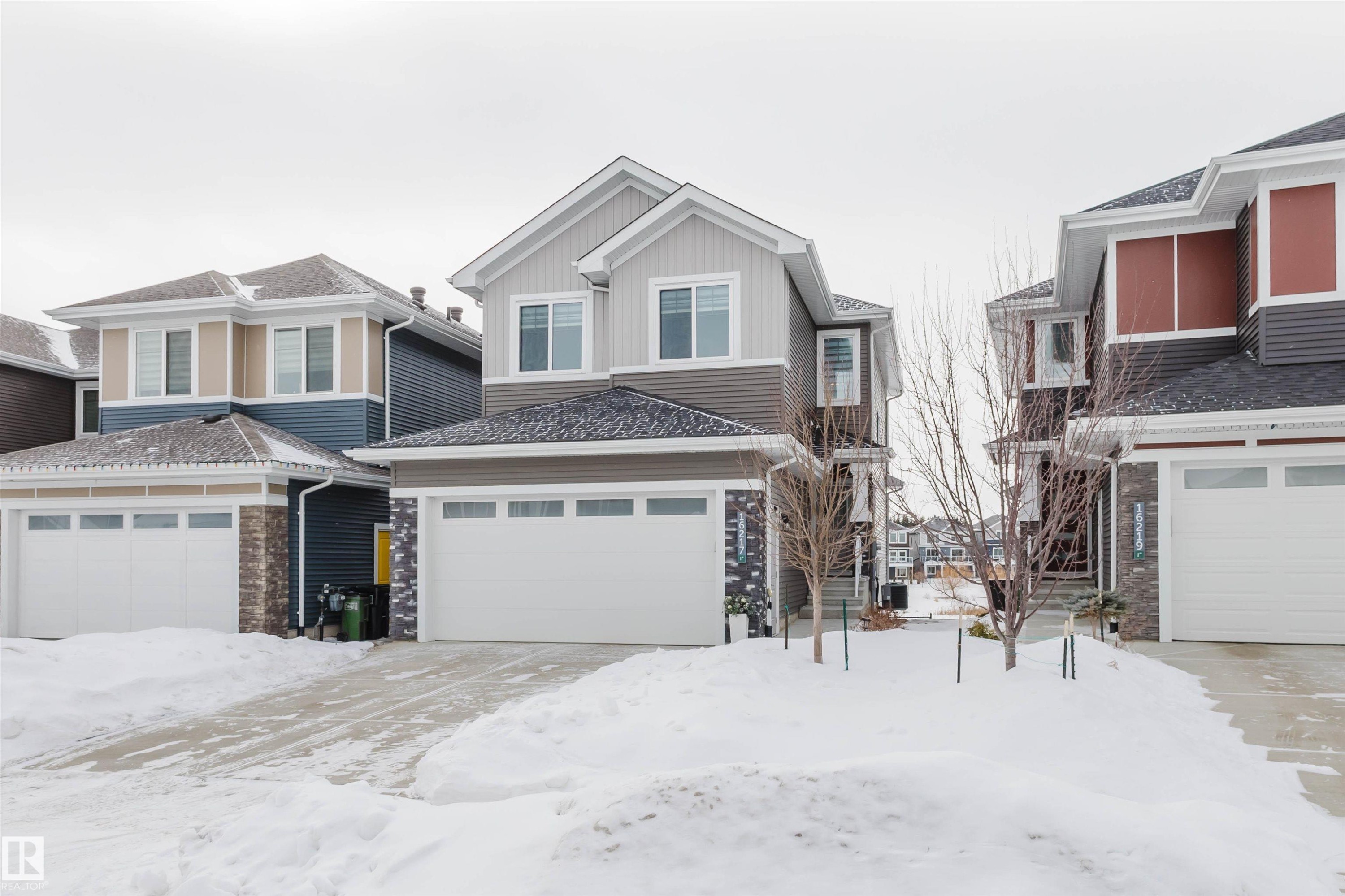 View of front of property featuring board and batten siding - 16217 32 Avenue, Edmonton, AB - Outdoor With Facade