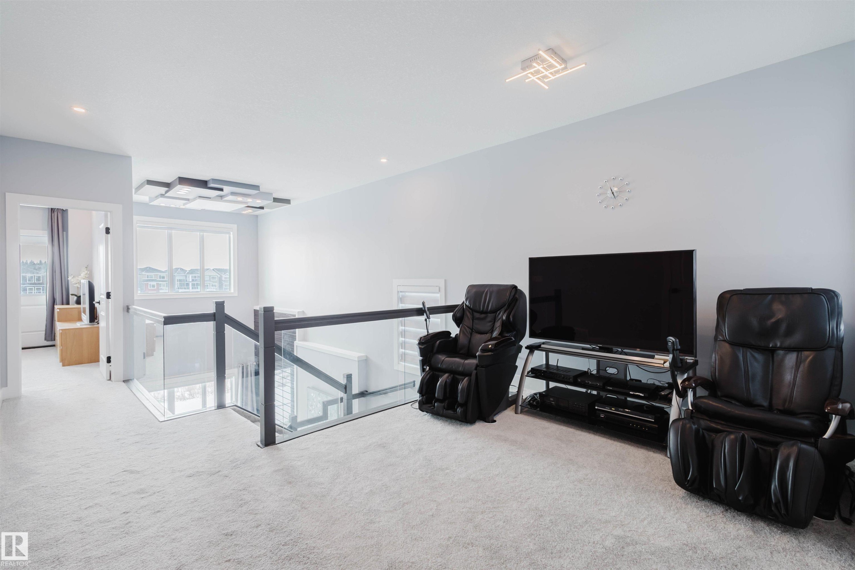 Sitting room featuring an upstairs landing, light carpet, and recessed lighting - 16217 32 Avenue, Edmonton, AB - Indoor Photo Showing Other Room