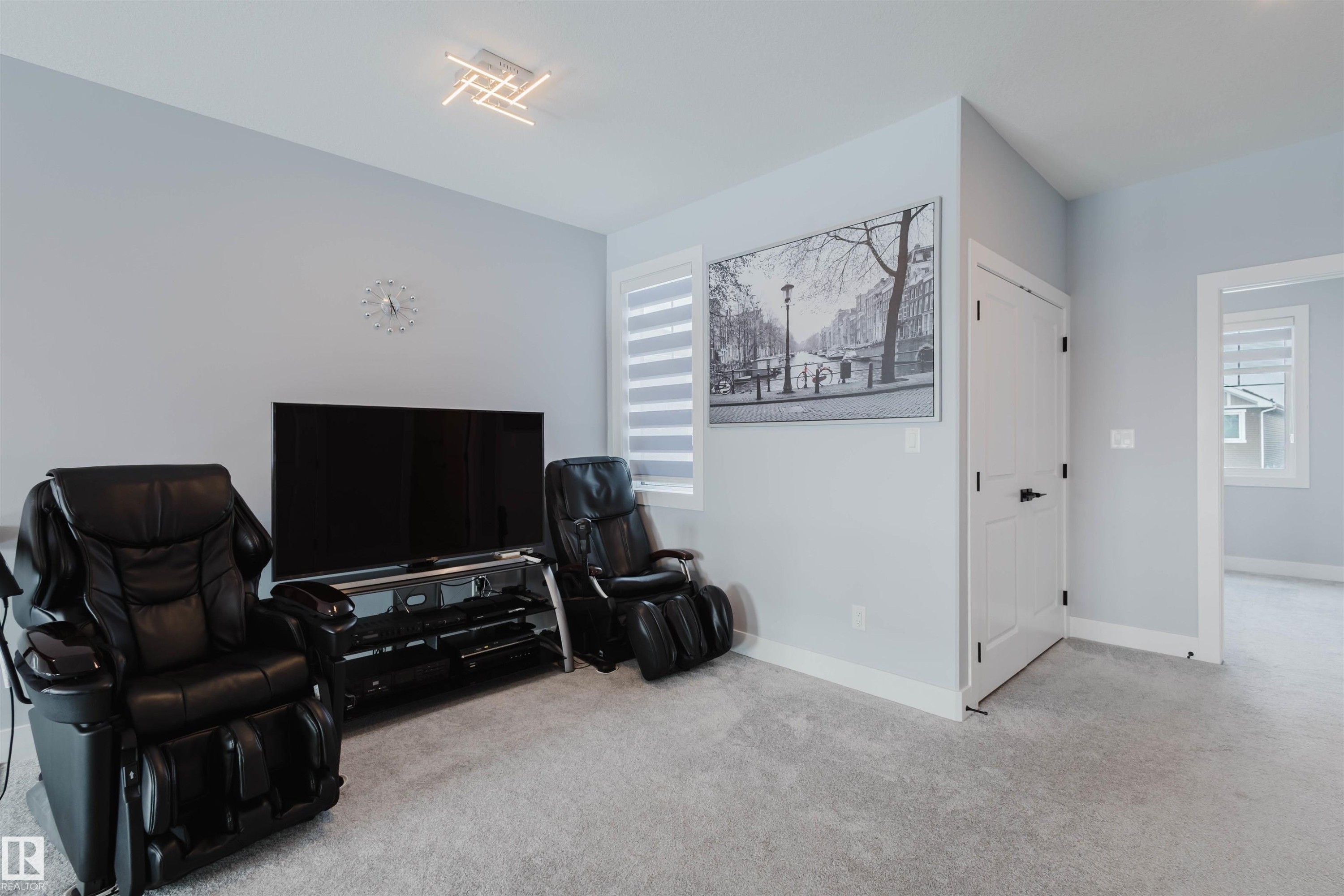 Sitting room featuring light colored carpet and plenty of natural light - 16217 32 Avenue, Edmonton, AB - Indoor