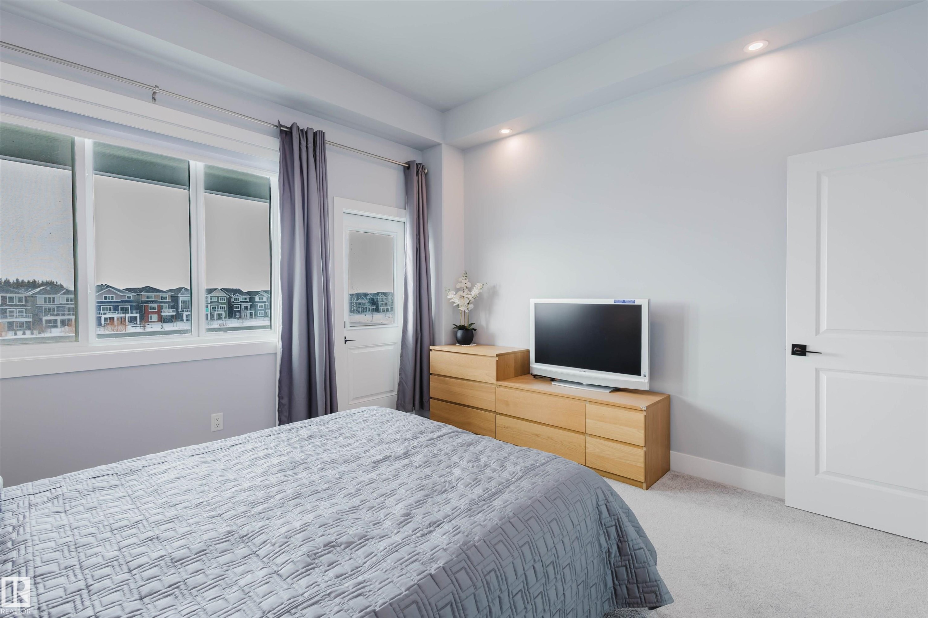 Bedroom featuring light carpet and recessed lighting - 16217 32 Avenue, Edmonton, AB - Indoor Photo Showing Bedroom