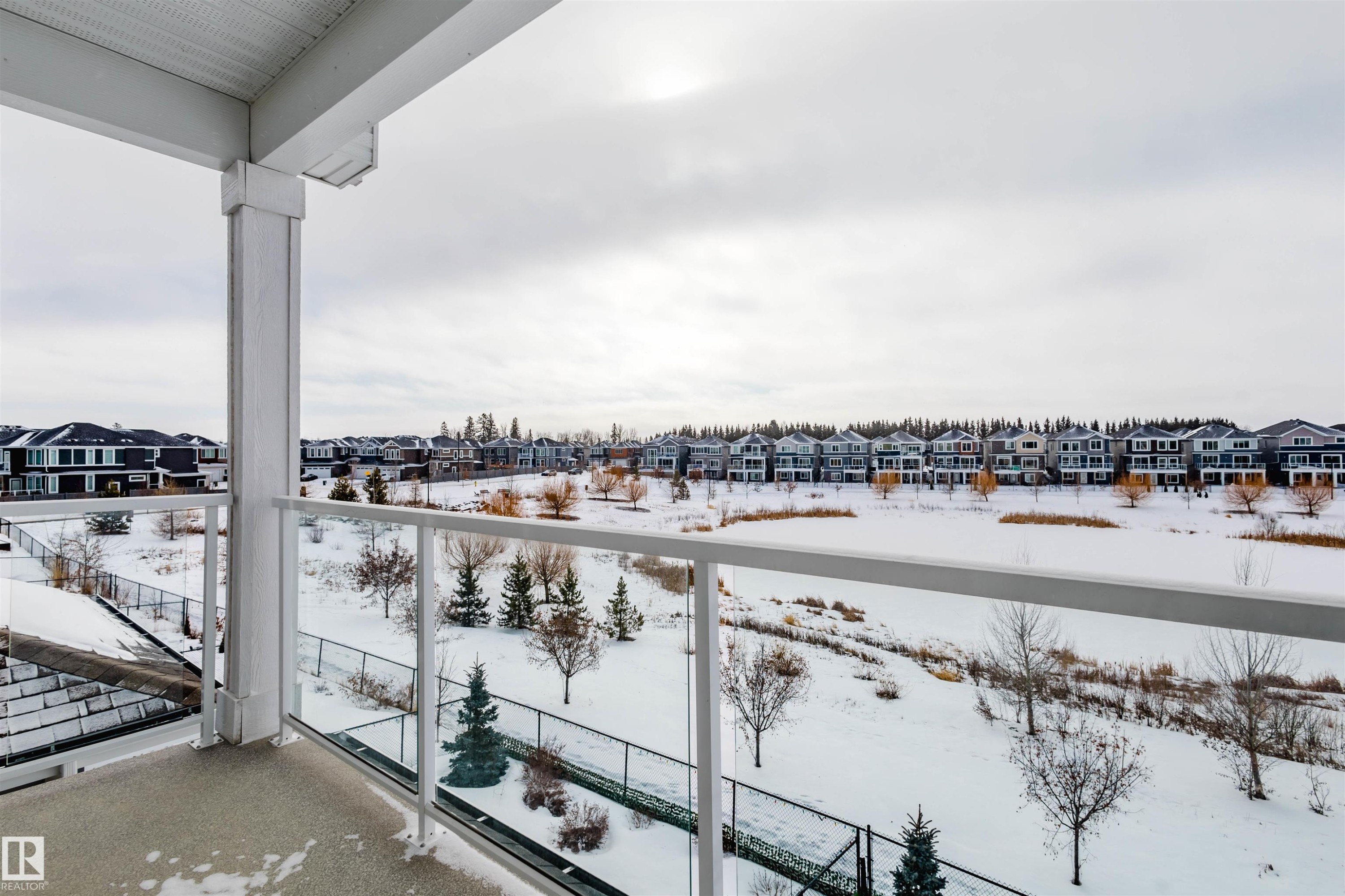 Snow covered back of property featuring a residential view - 16217 32 Avenue, Edmonton, AB - Outdoor With Balcony With View