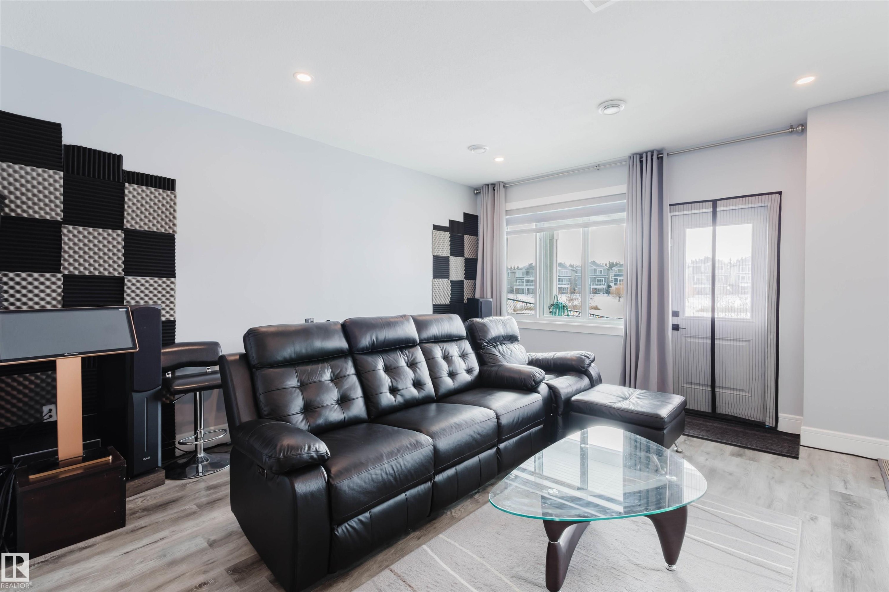 Living area with light wood-style floors and recessed lighting - 16217 32 Avenue, Edmonton, AB - Indoor Photo Showing Living Room