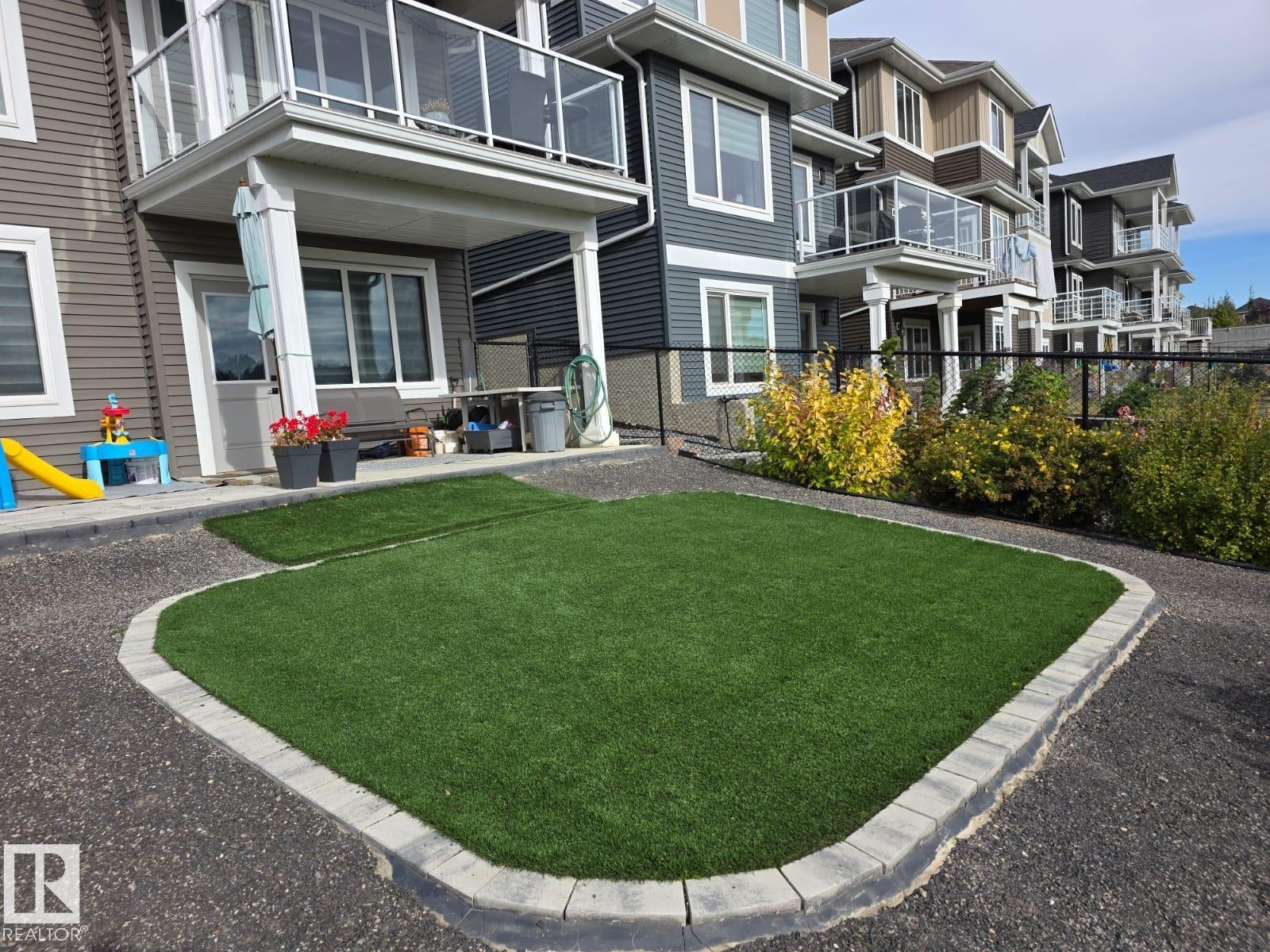 View of yard featuring a balcony and a patio area - 16217 32 Avenue, Edmonton, AB - Outdoor With Balcony