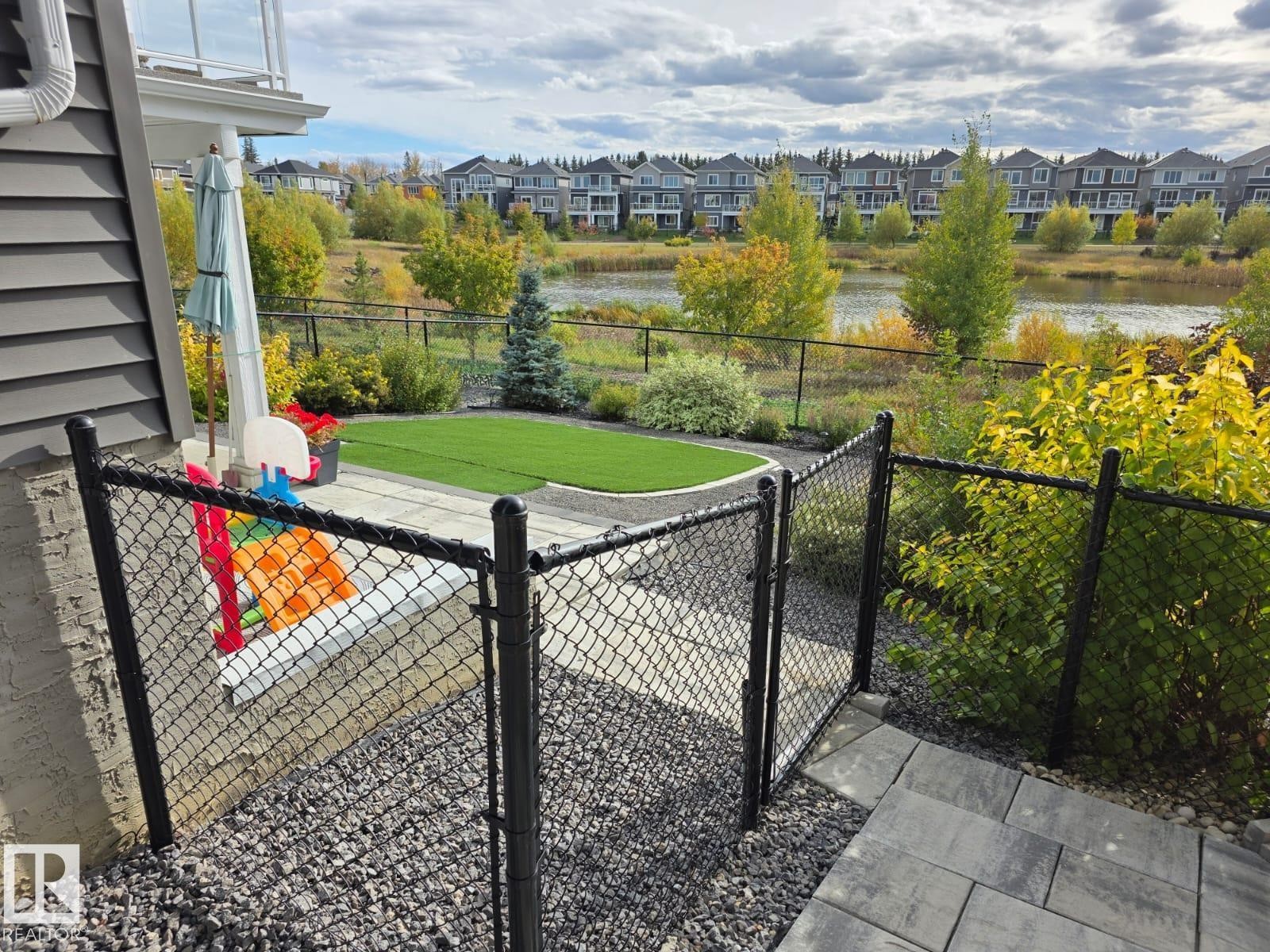 Balcony featuring a water view and a residential view - 16217 32 Avenue, Edmonton, AB - Outdoor With View