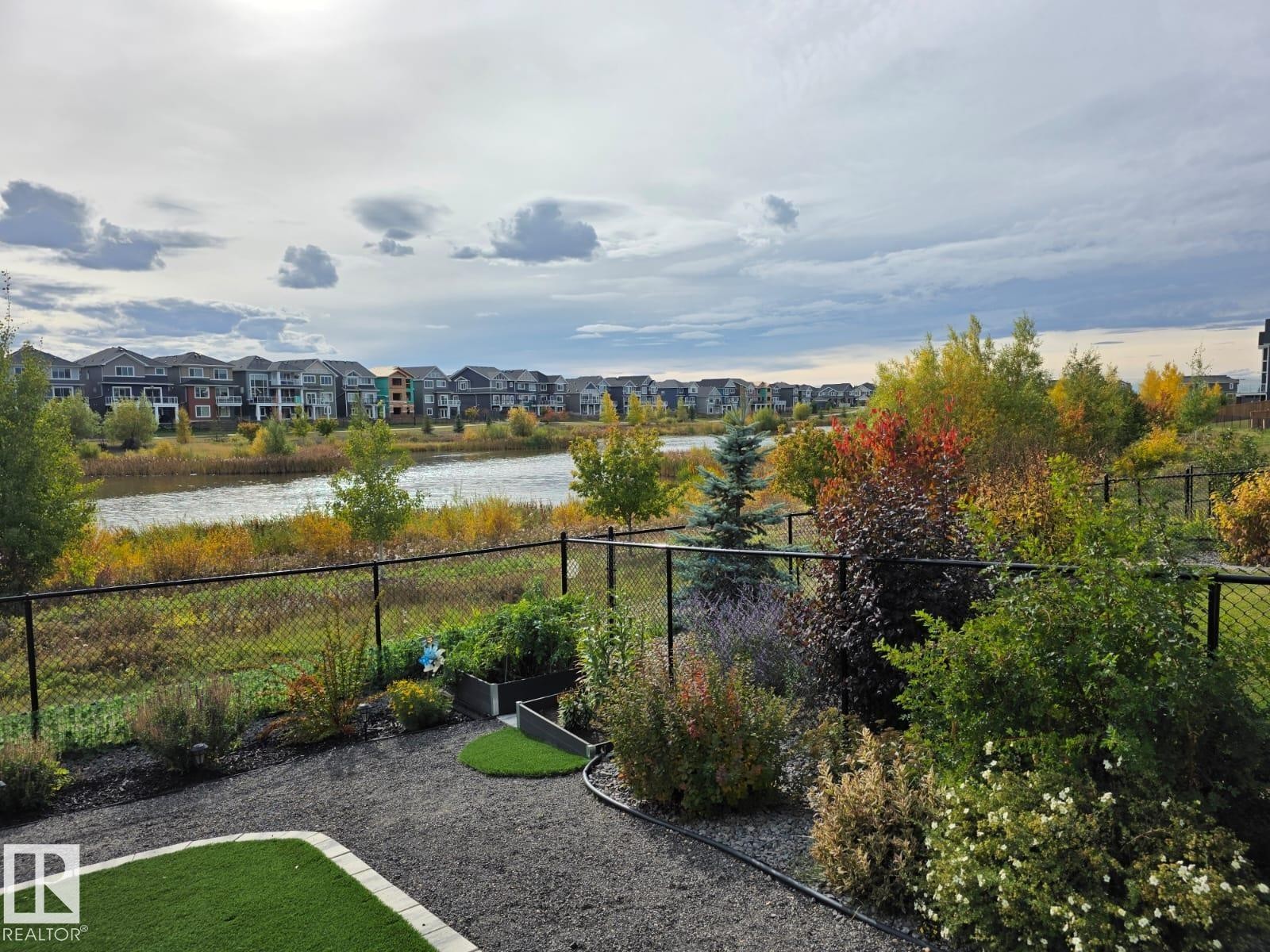 View of yard featuring a water view and a residential view - 16217 32 Avenue, Edmonton, AB - Outdoor With View