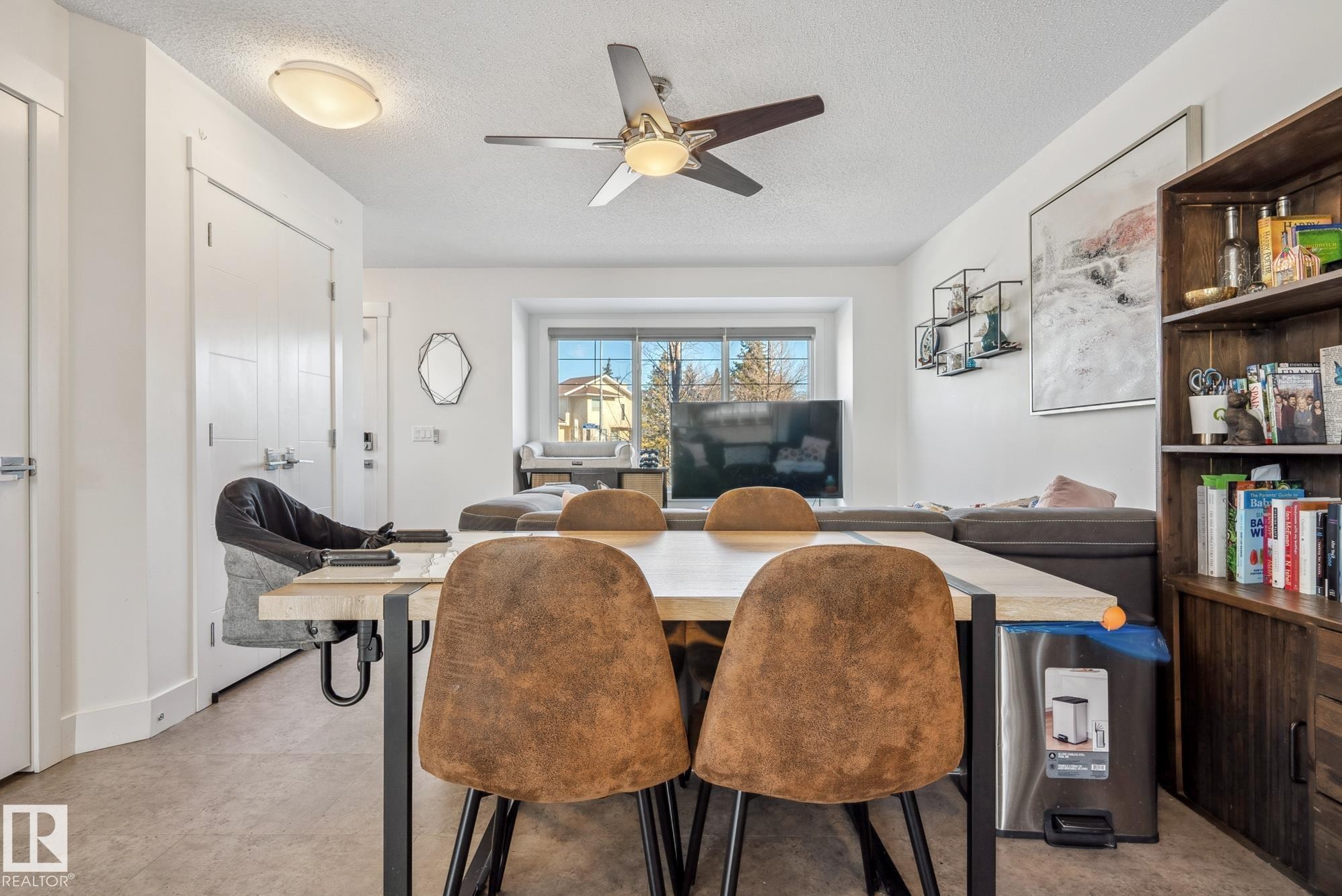 Dining area featuring a ceiling fan and a textured ceiling - 76 330 Bulyea Road, Edmonton, AB - Indoor