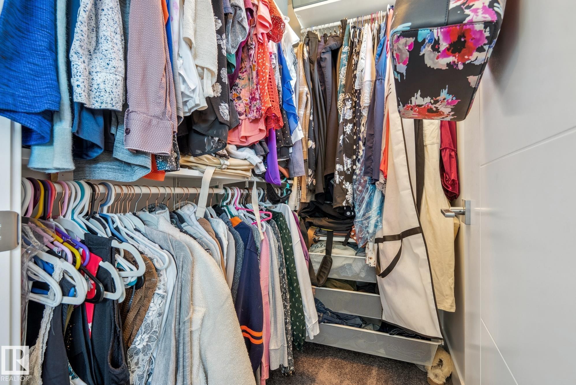 Spacious closet featuring dark colored carpet - 76 330 Bulyea Road, Edmonton, AB - Indoor With Storage