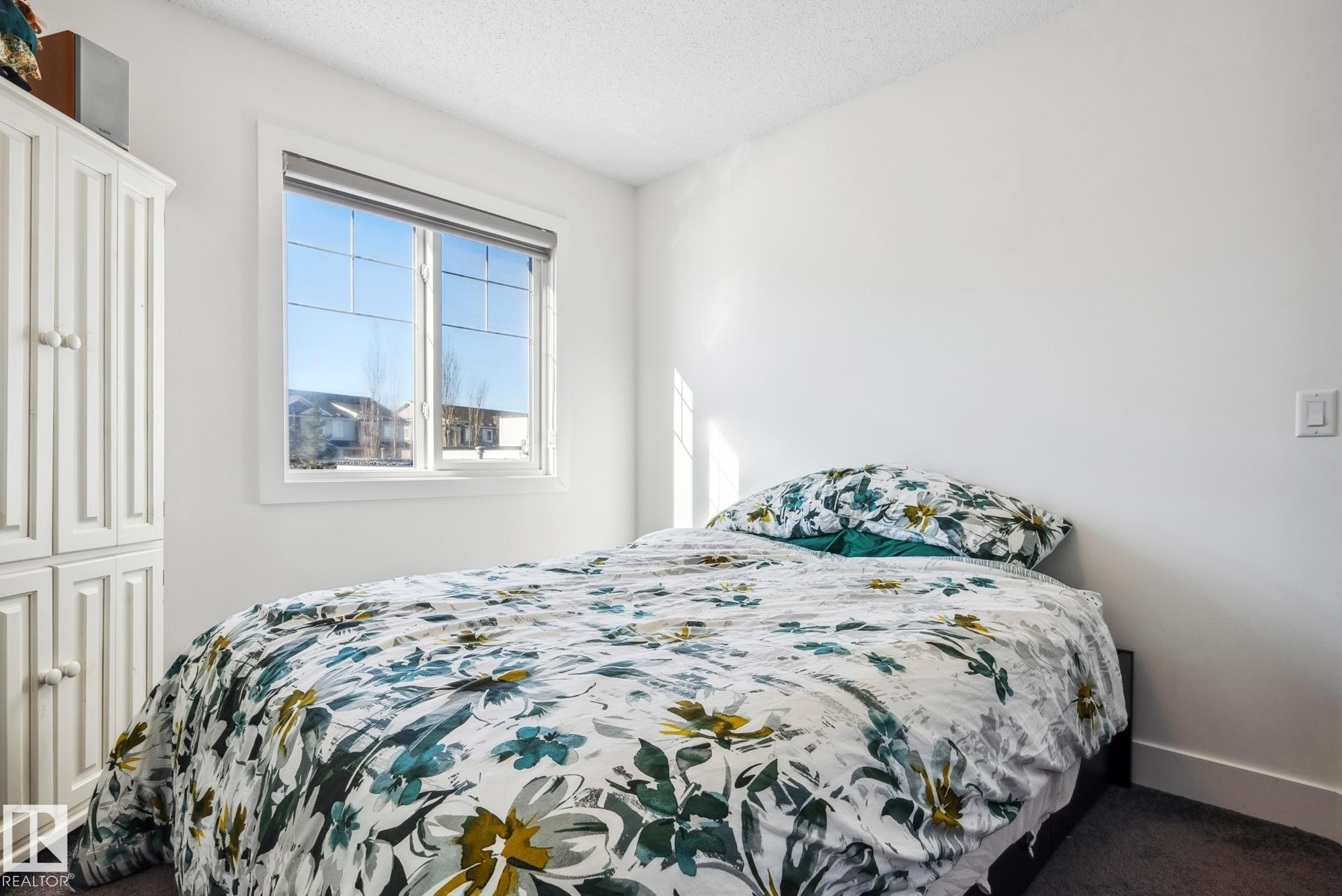 Bedroom featuring carpet flooring and a textured ceiling - 76 330 Bulyea Road, Edmonton, AB - Indoor Photo Showing Bedroom