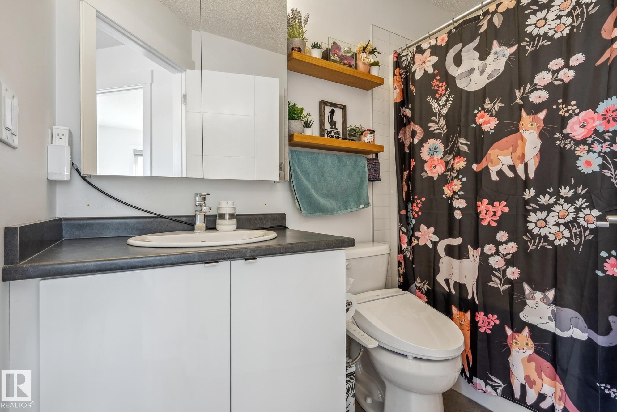 Bathroom featuring vanity and a shower with curtain - 76 330 Bulyea Road, Edmonton, AB - Indoor Photo Showing Bathroom