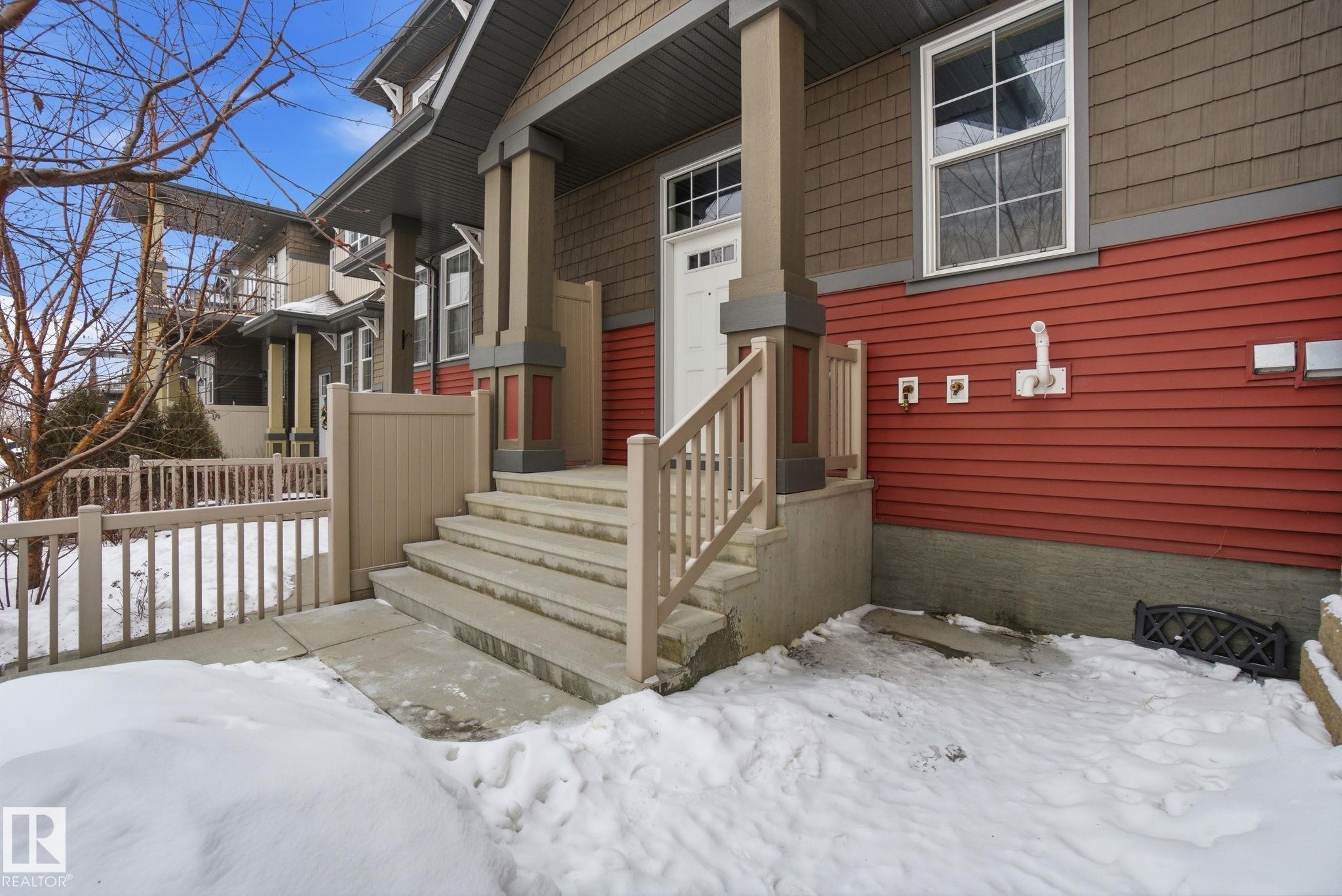 View of snow covered property entrance - 71 4029 Orchards Drive, Edmonton, AB - Outdoor
