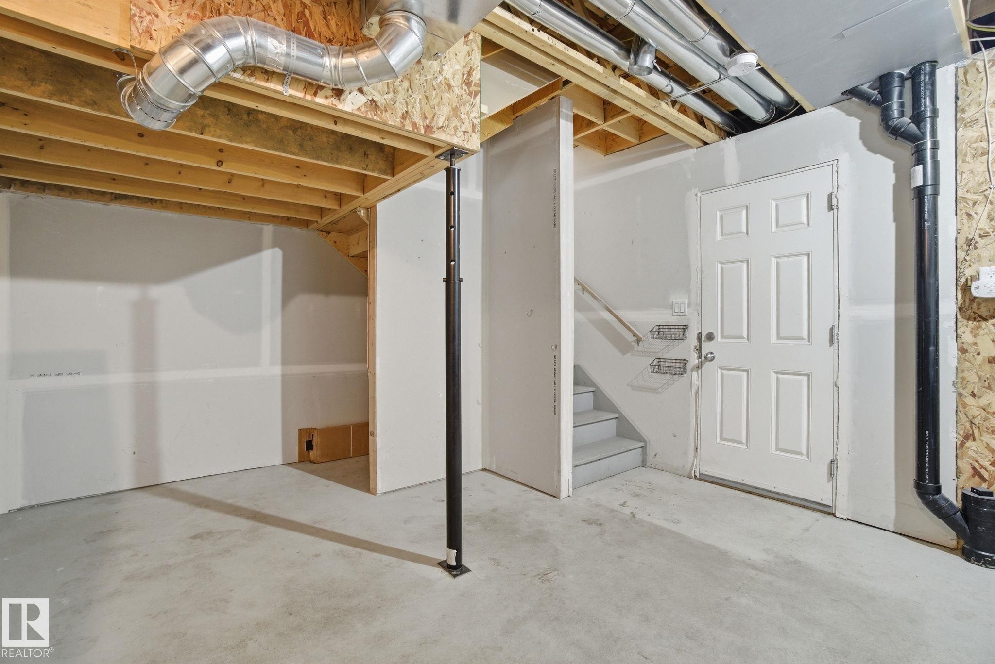 Unfinished below grade area with stairs - 71 4029 Orchards Drive, Edmonton, AB - Indoor Photo Showing Basement
